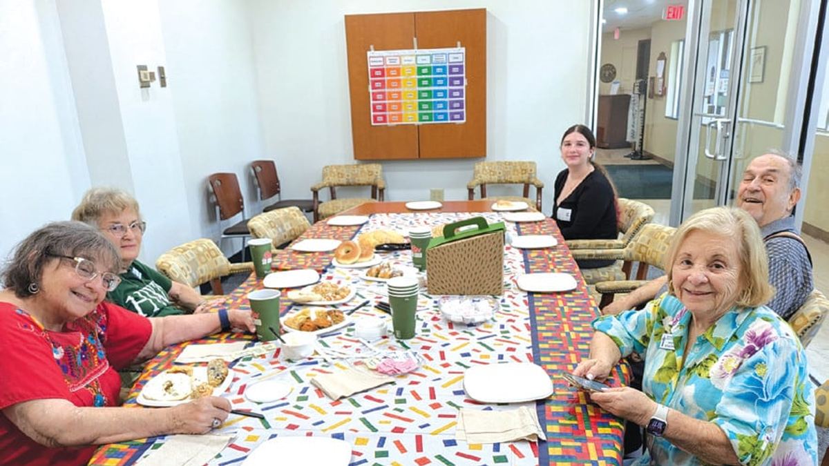 Seniors gather around a table for a Jewish Pavilion arts program