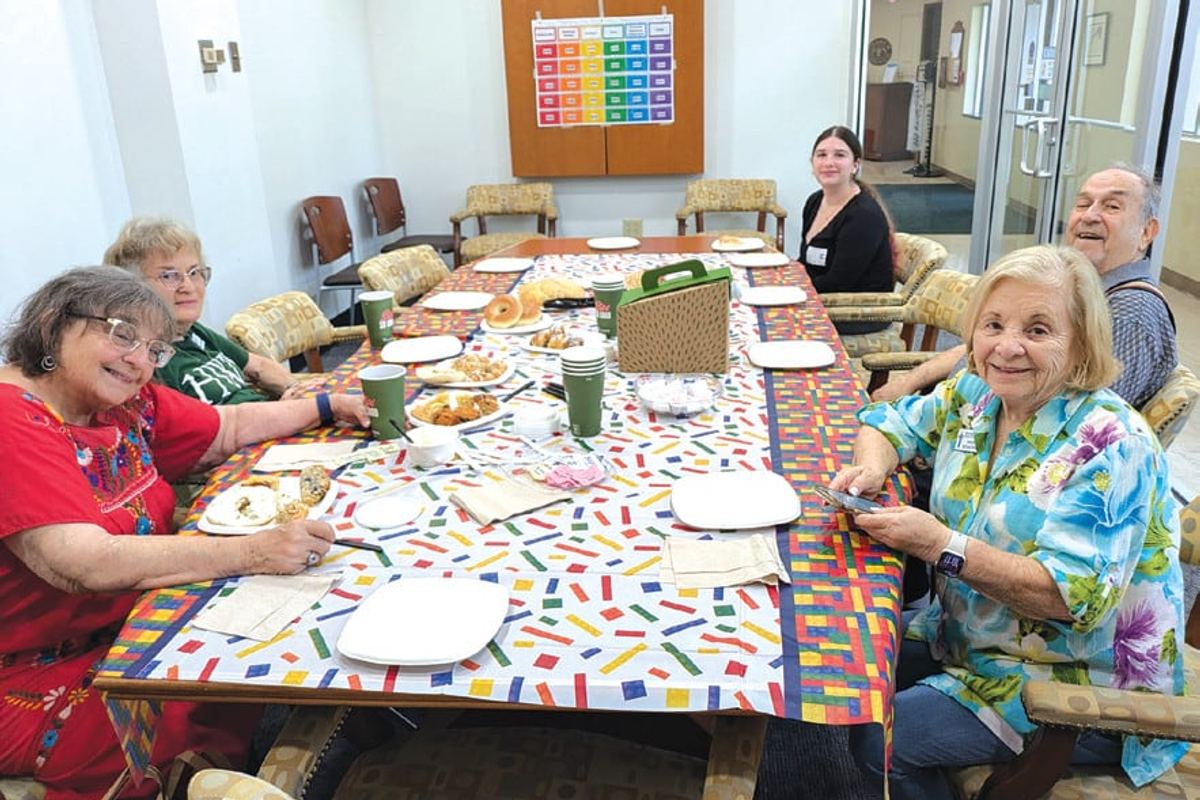 Seniors gather around a table for a Jewish Pavilion arts program