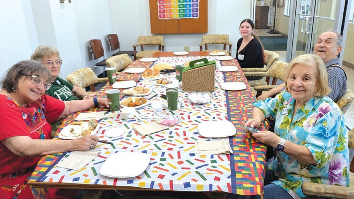 Seniors gather around a table for a Jewish Pavilion arts program