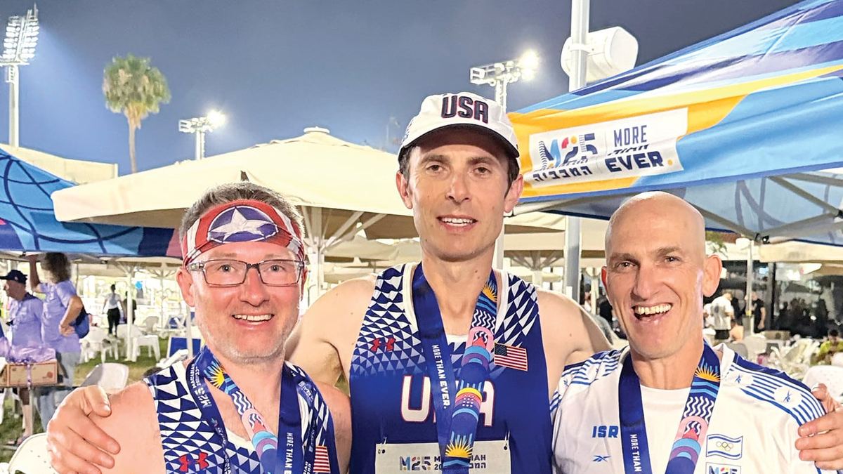 Tom Butler with Zory Shaposhnik and Meir Kaufman, wearing their medals