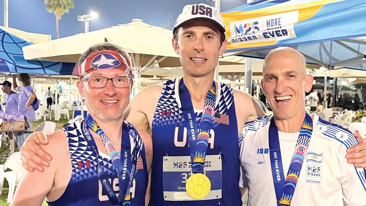 Tom Butler with Zory Shaposhnik and Meir Kaufman, wearing their medals