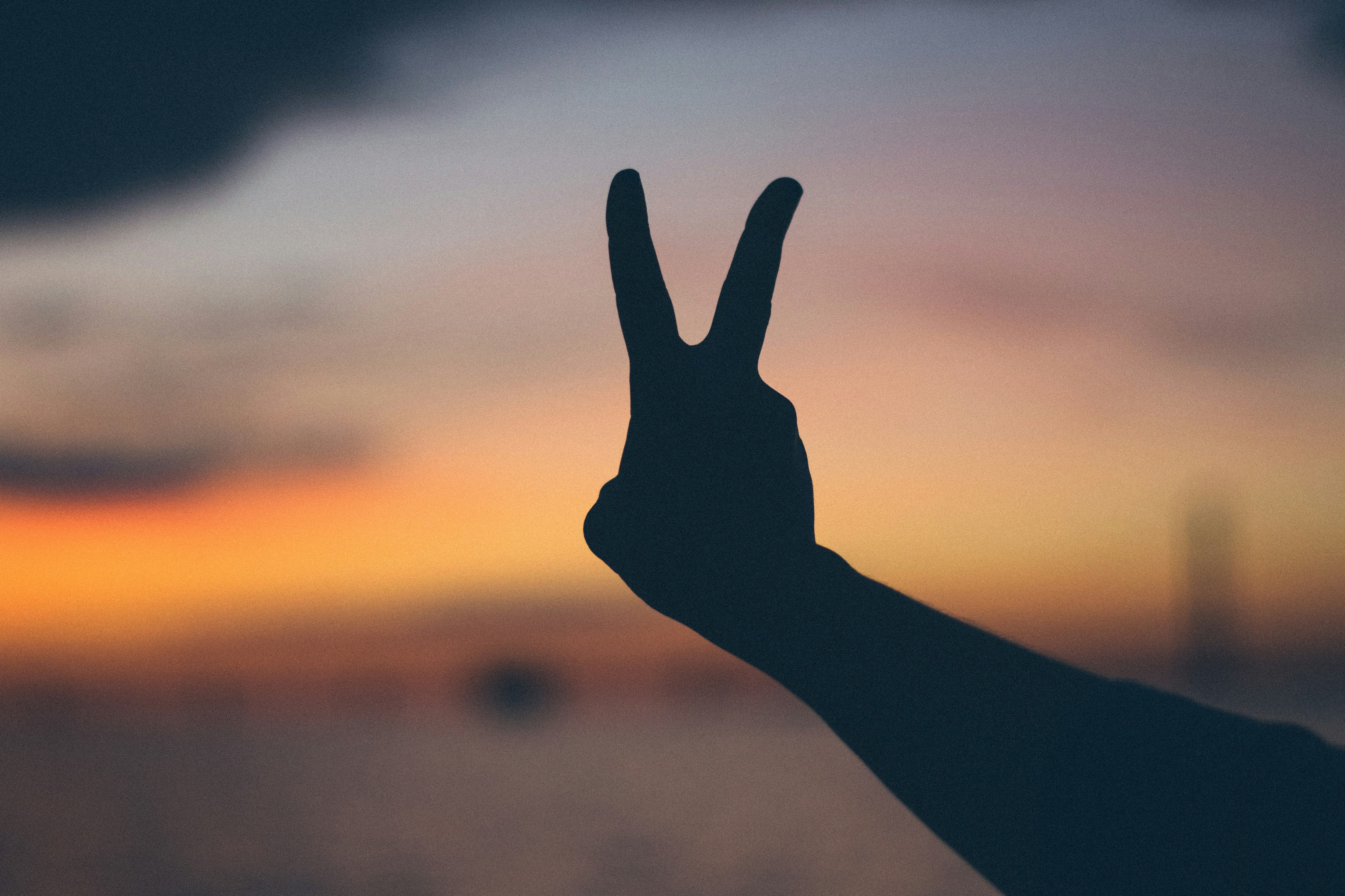 A hand holding 2 fingers up