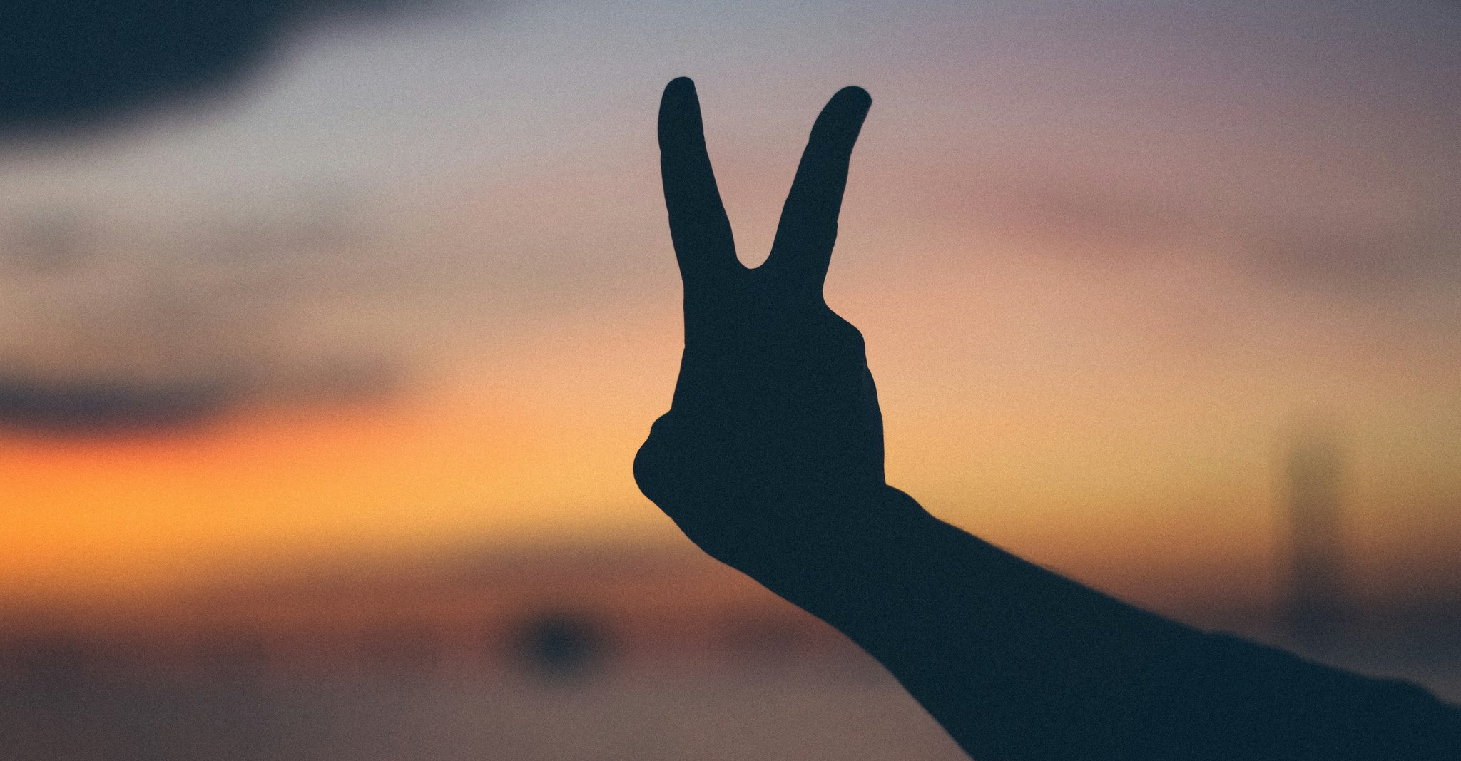 A hand holding 2 fingers up