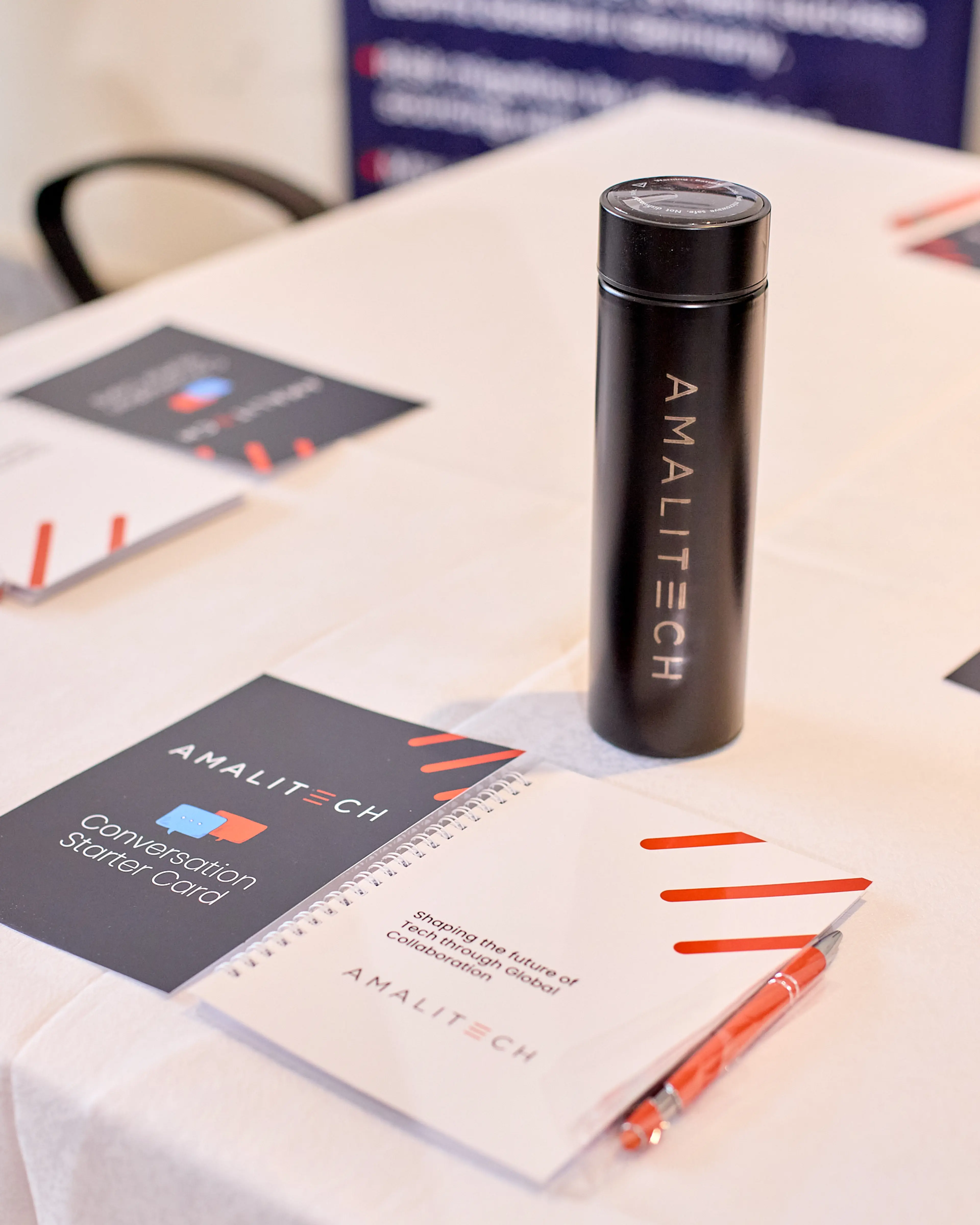 AmaliTech branded souvenirs on a table