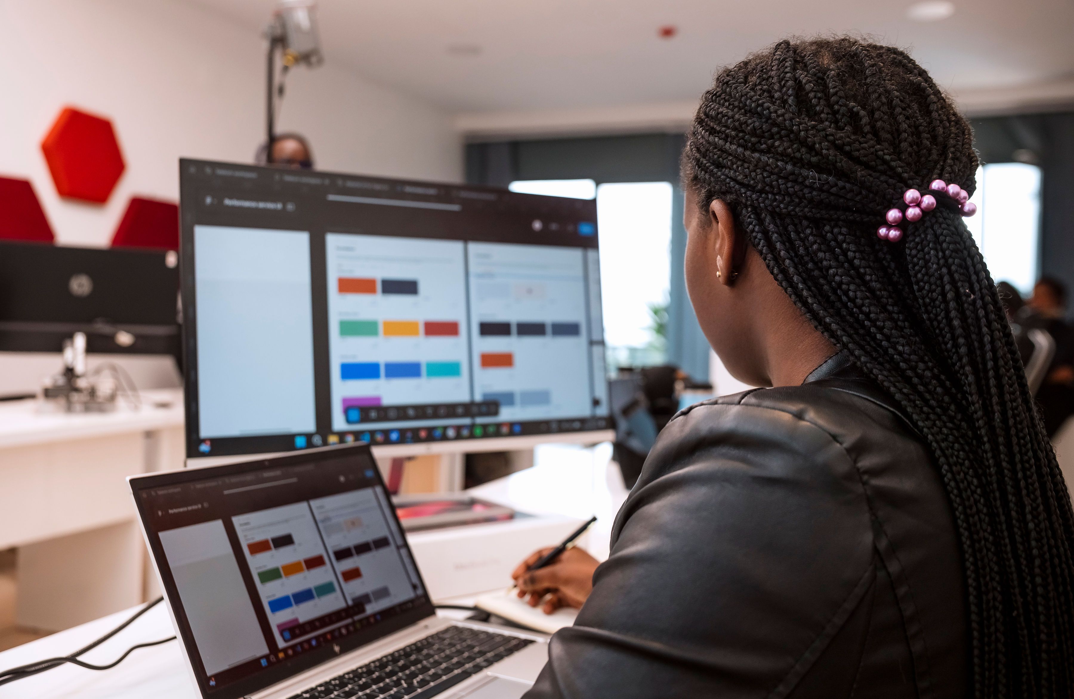 An over the shoulder view of a women working on her computer