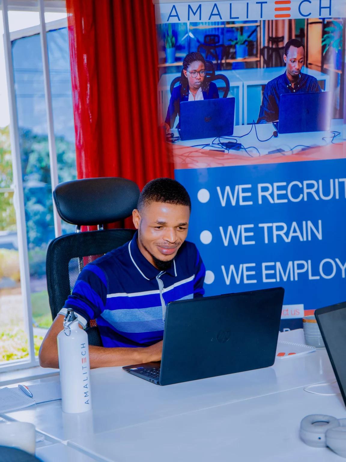 A person sitting behind a laptop