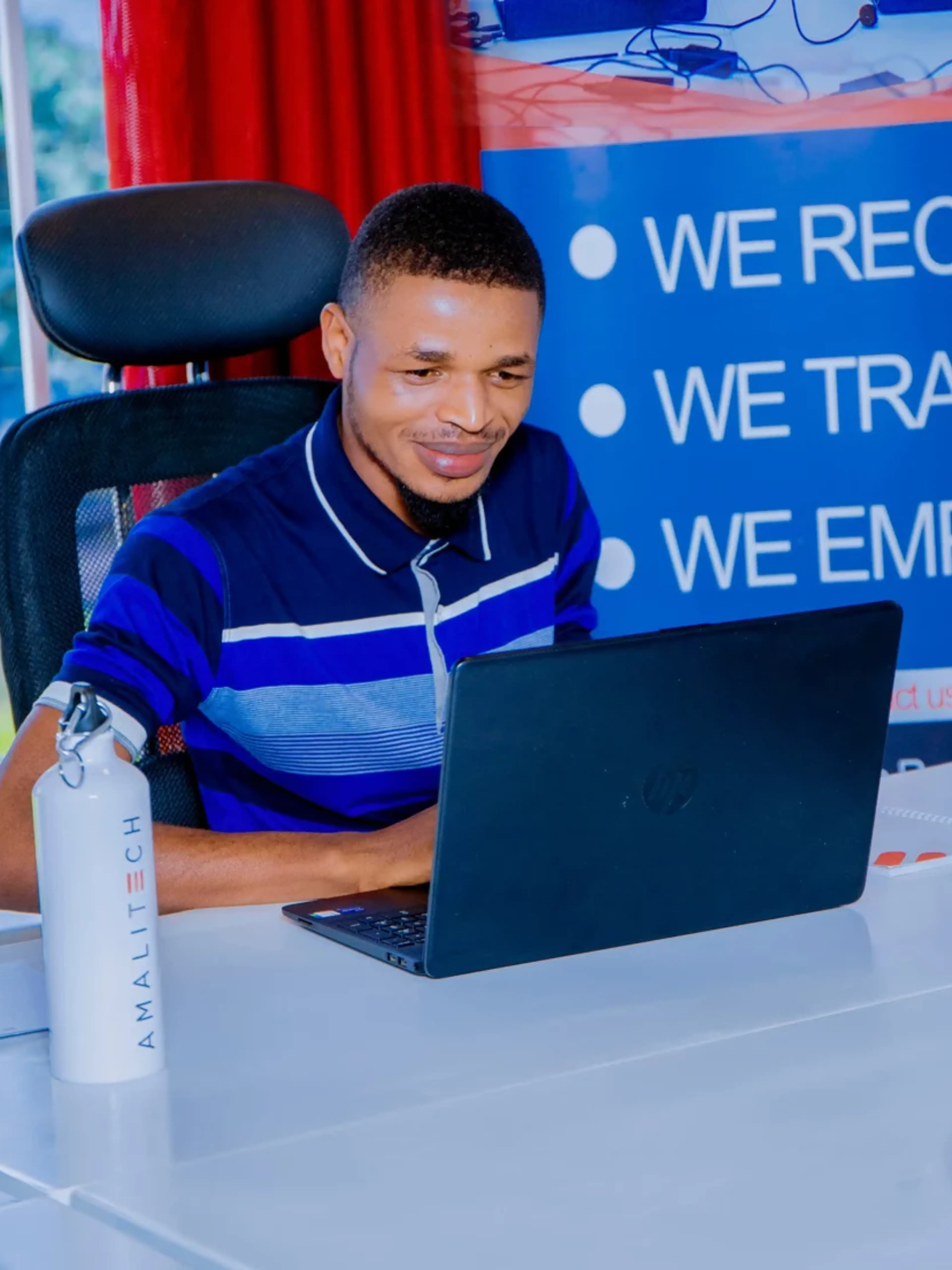 A person sitting behind a laptop