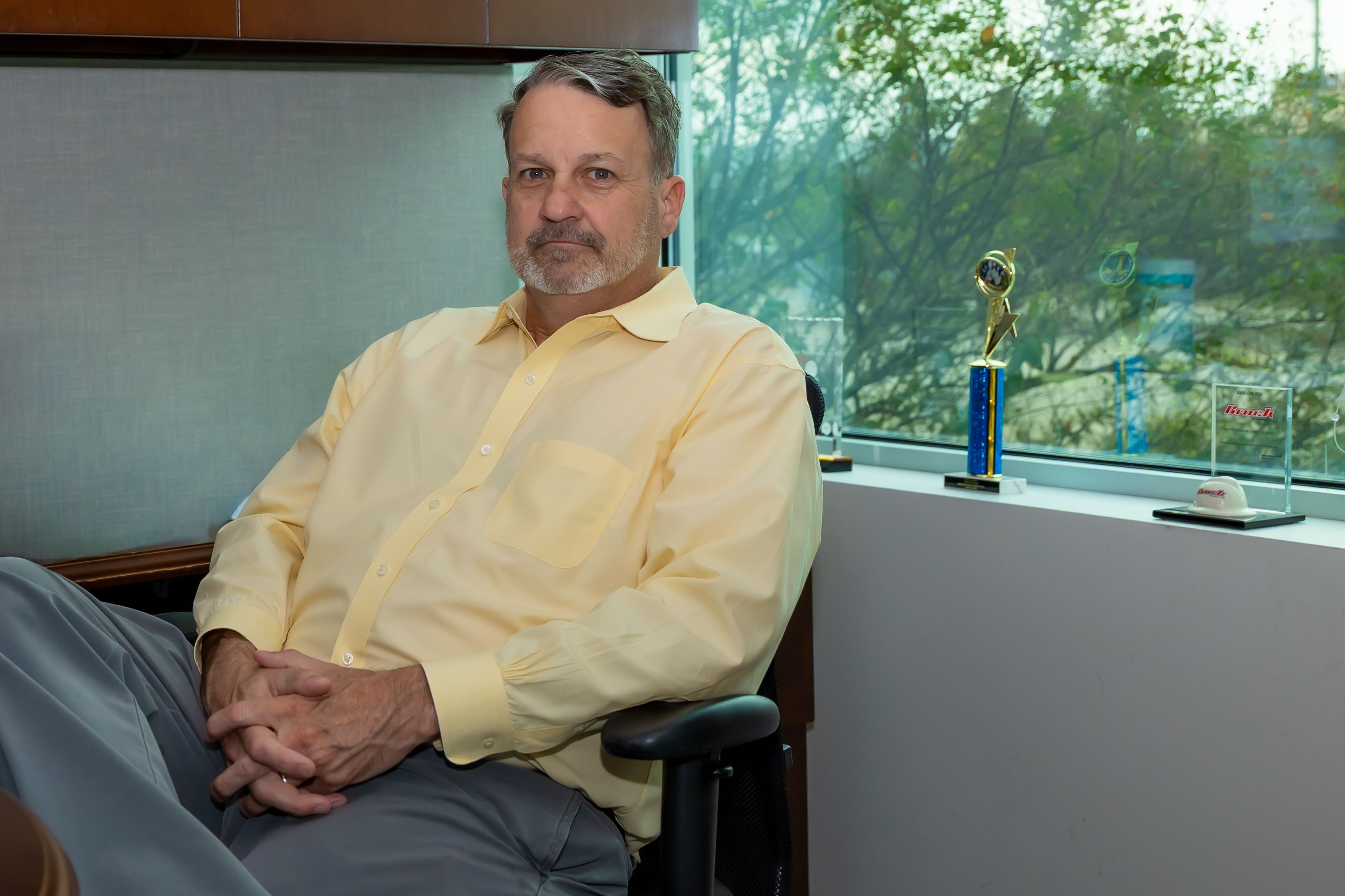 A picture of Chris Dorsey sitting at his desk