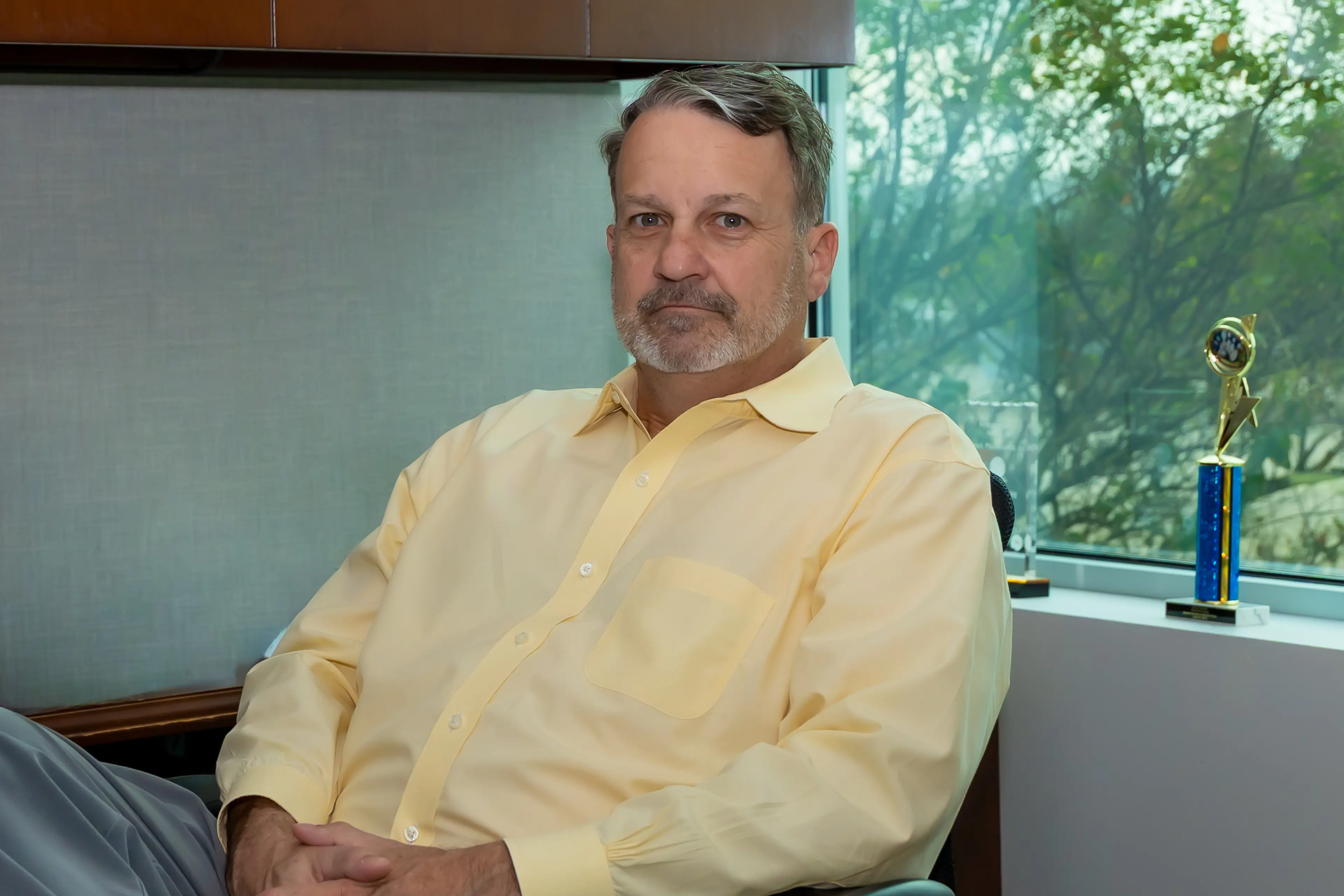 A picture of Chris Dorsey sitting at his desk