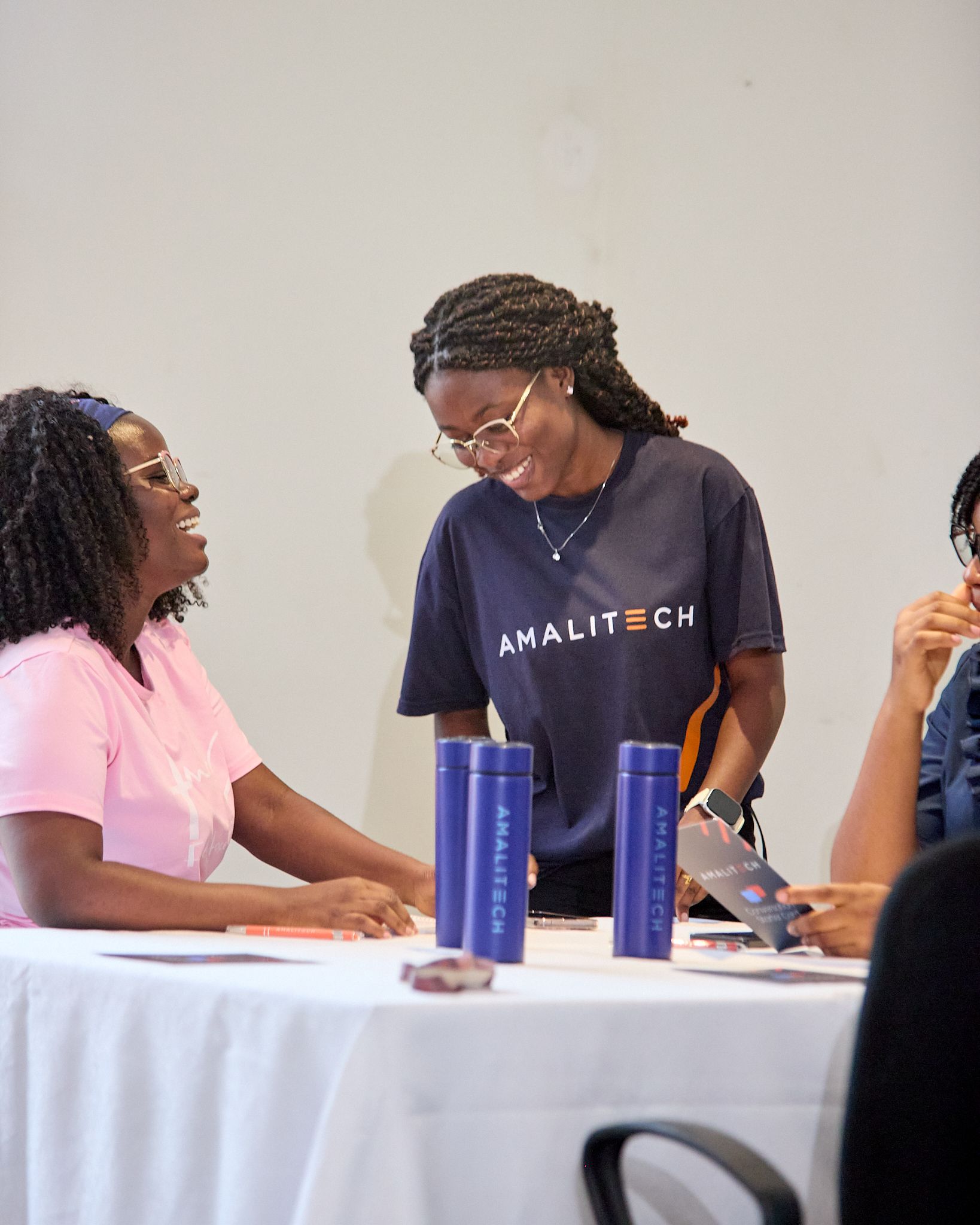 two young ladies having a conversation and smiling
