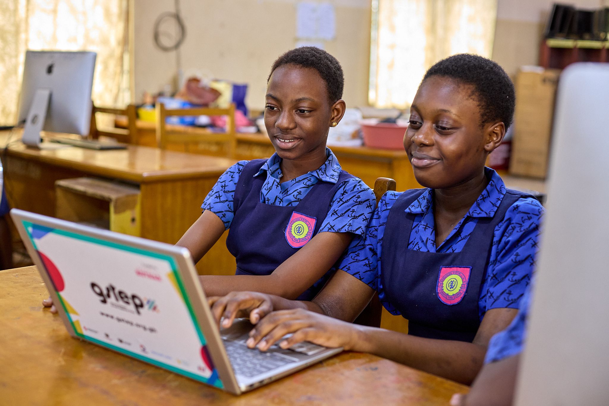 Two children working on a computer
