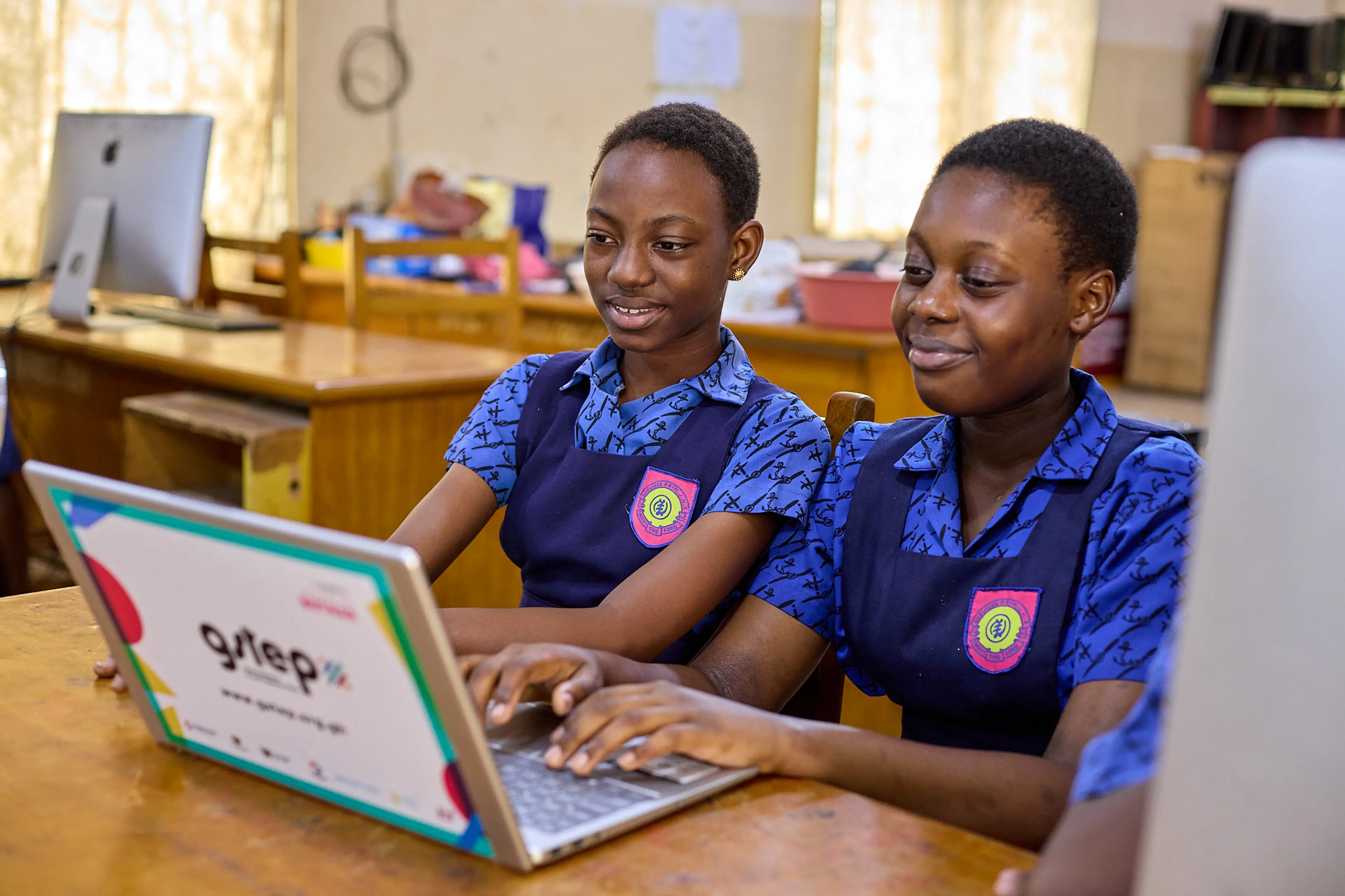 Two children working on a computer