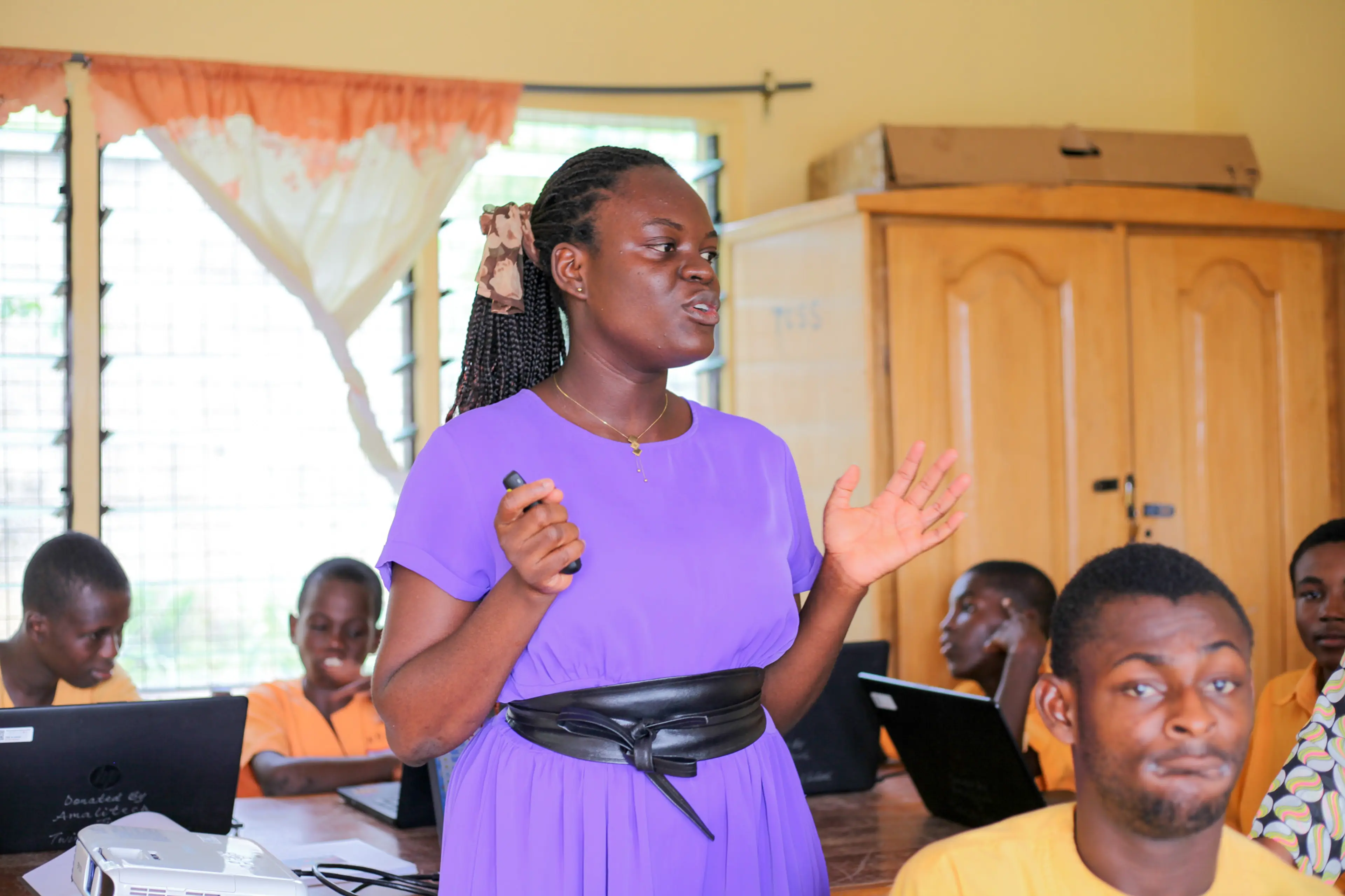 A young lady in the midst of students
