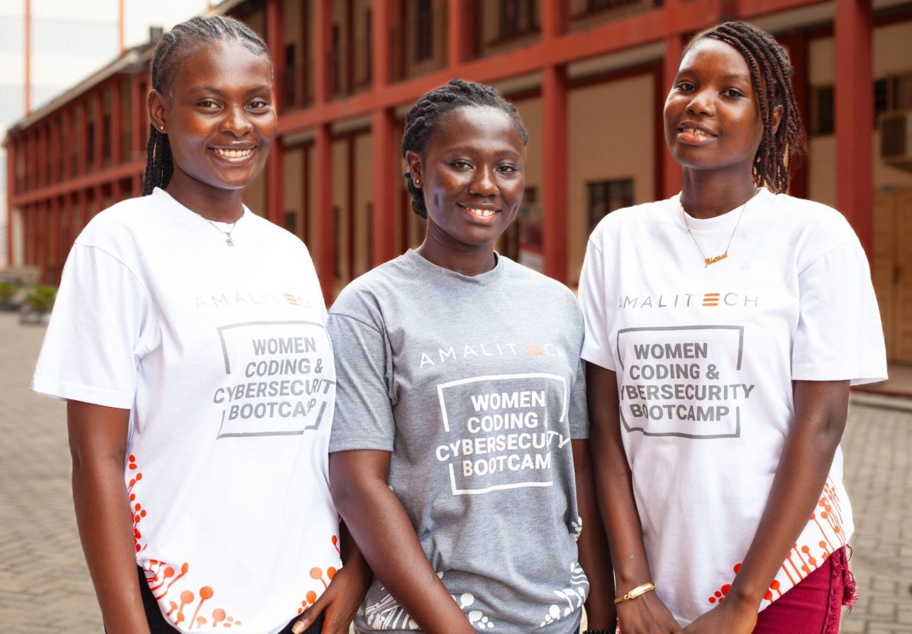 a group of 3 ladies in a tshirt with the inscription women coding & cybersecurity bootcamp