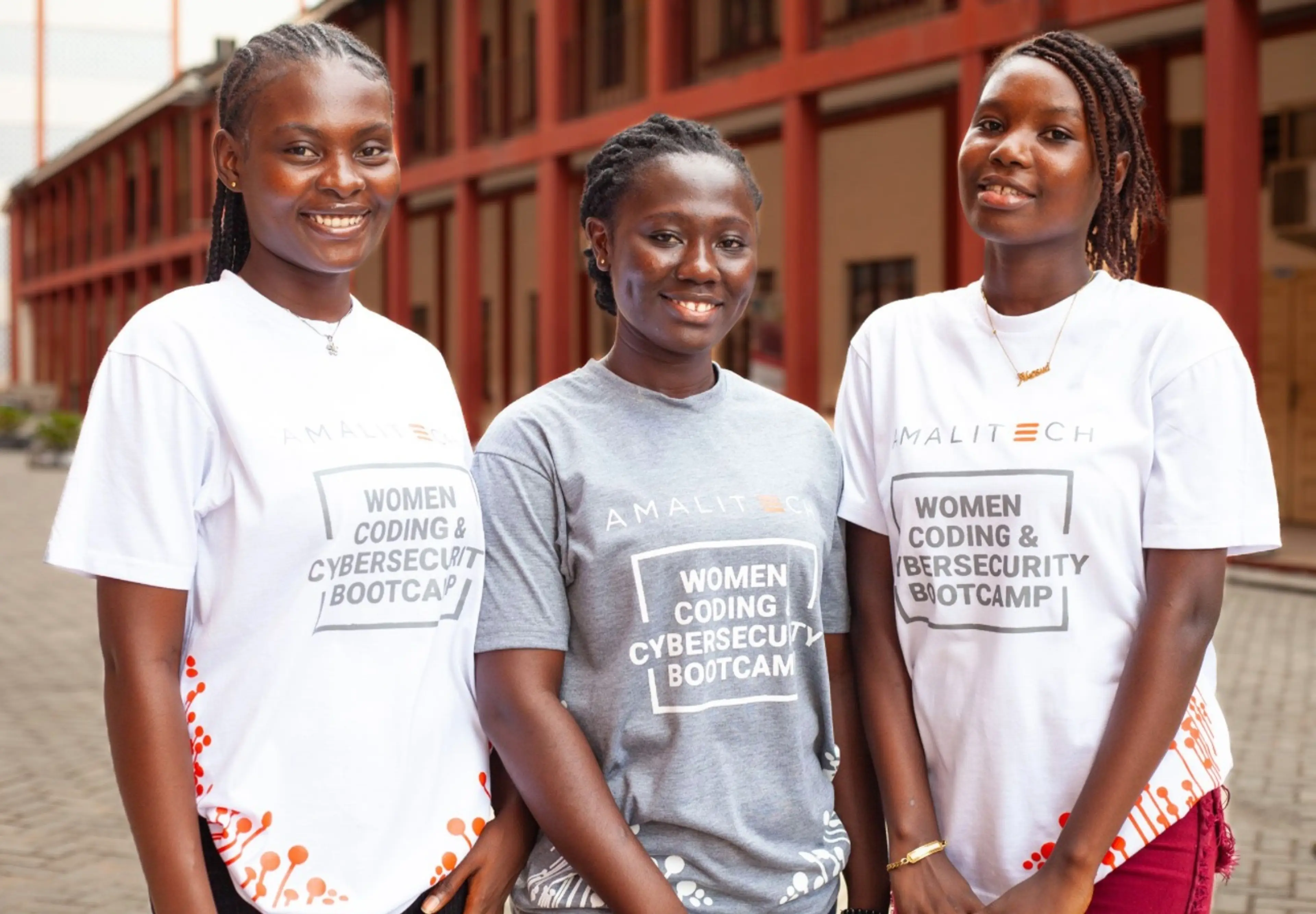 a group of 3 ladies in a tshirt with the inscription women coding & cybersecurity bootcamp