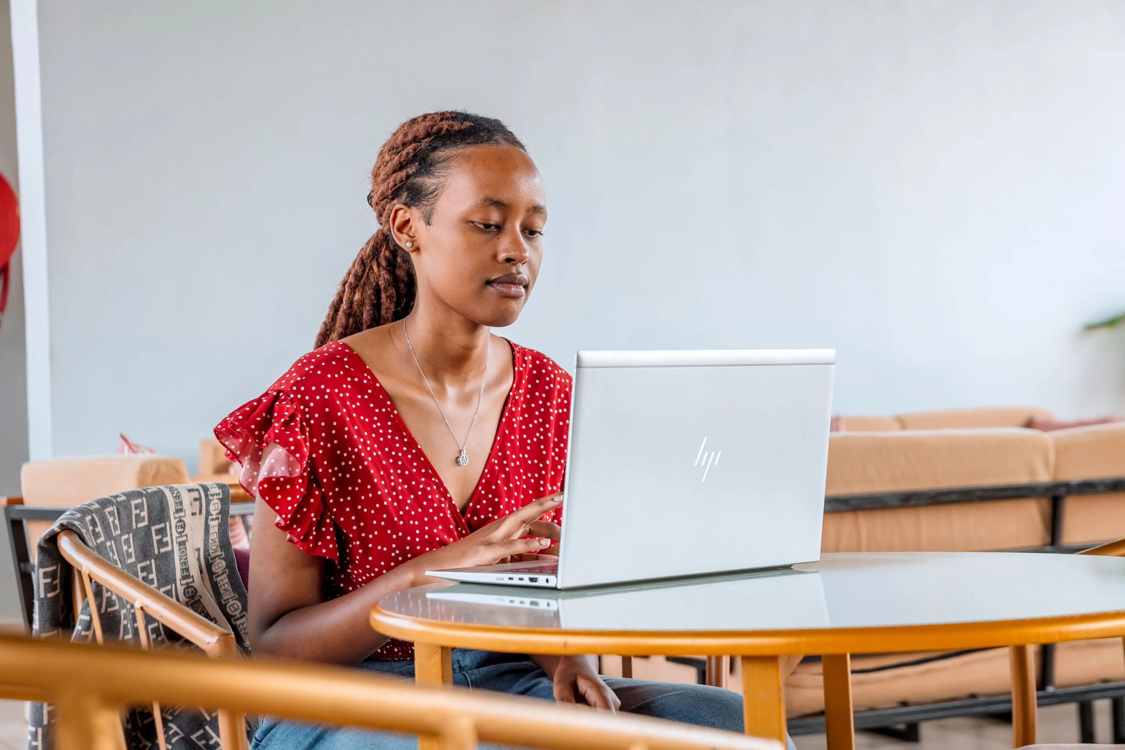 A women, working on her computer