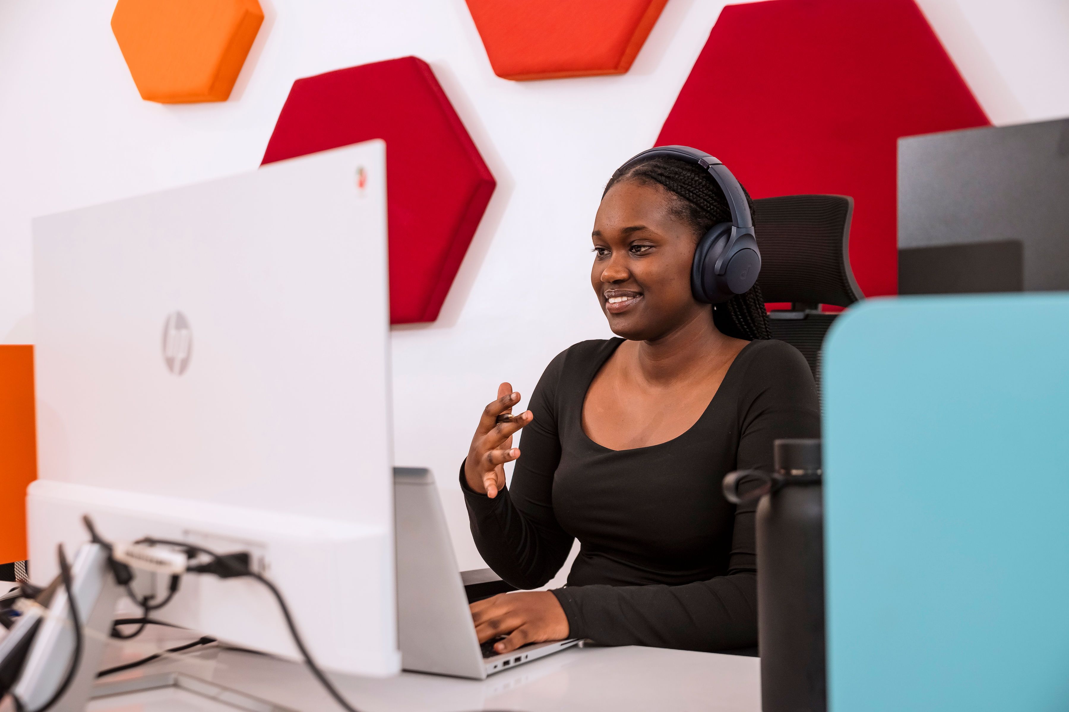 Two women looking a the computer and smiling
