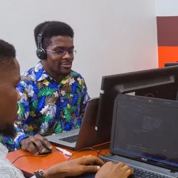 Two amalitech employees working at their desk