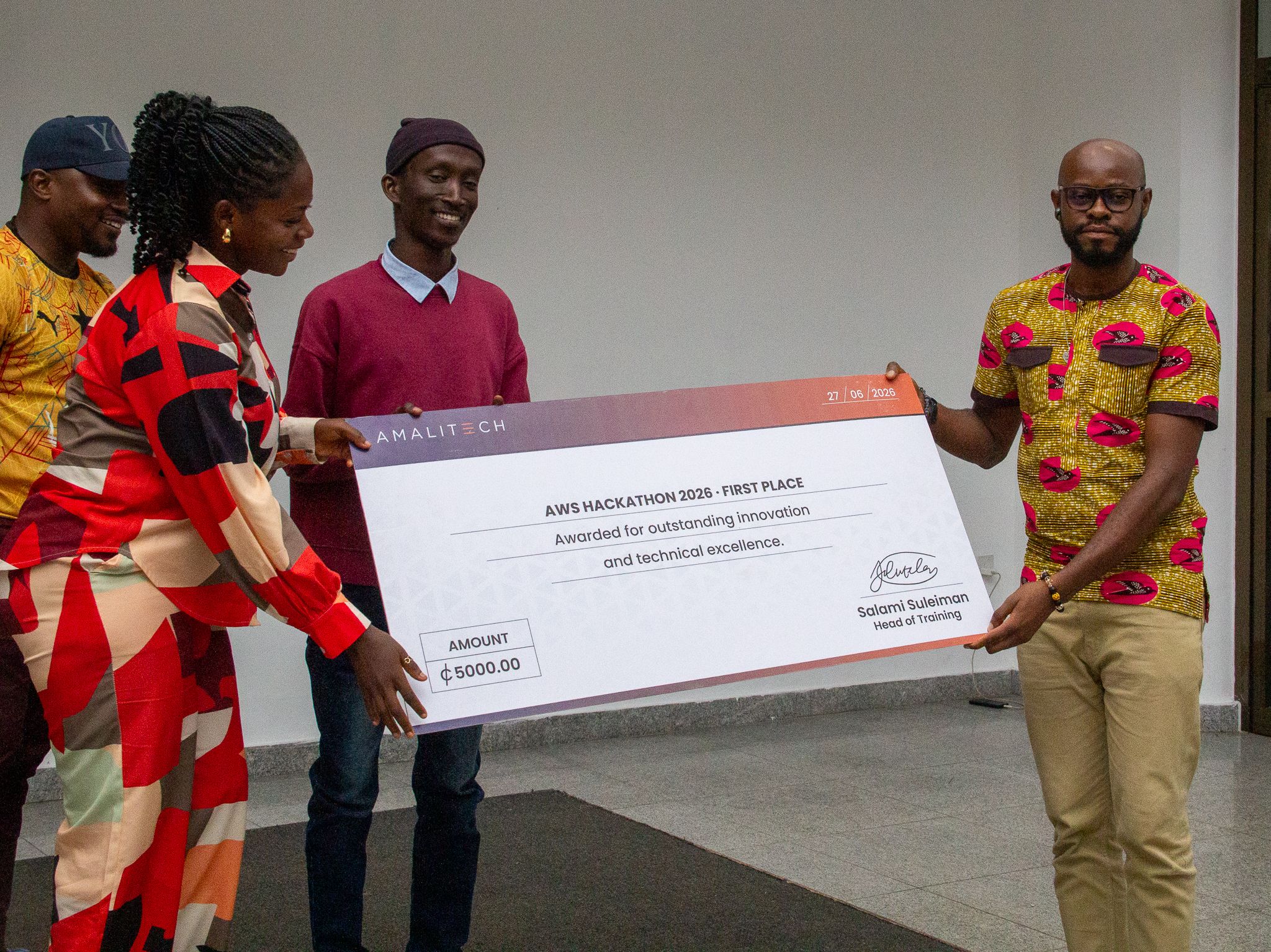 Participants receiving a dummy cheque as an award for their participation