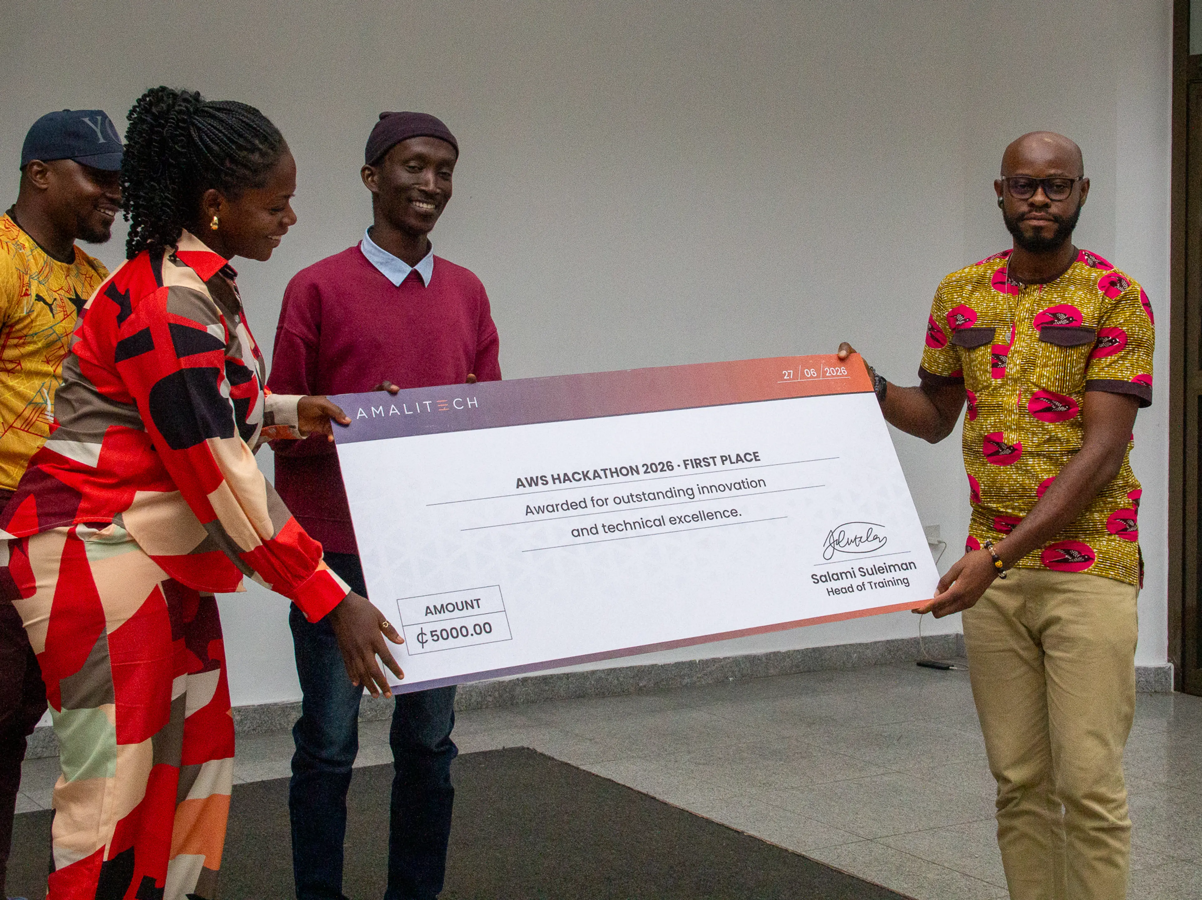 Participants receiving a dummy cheque as an award for their participation