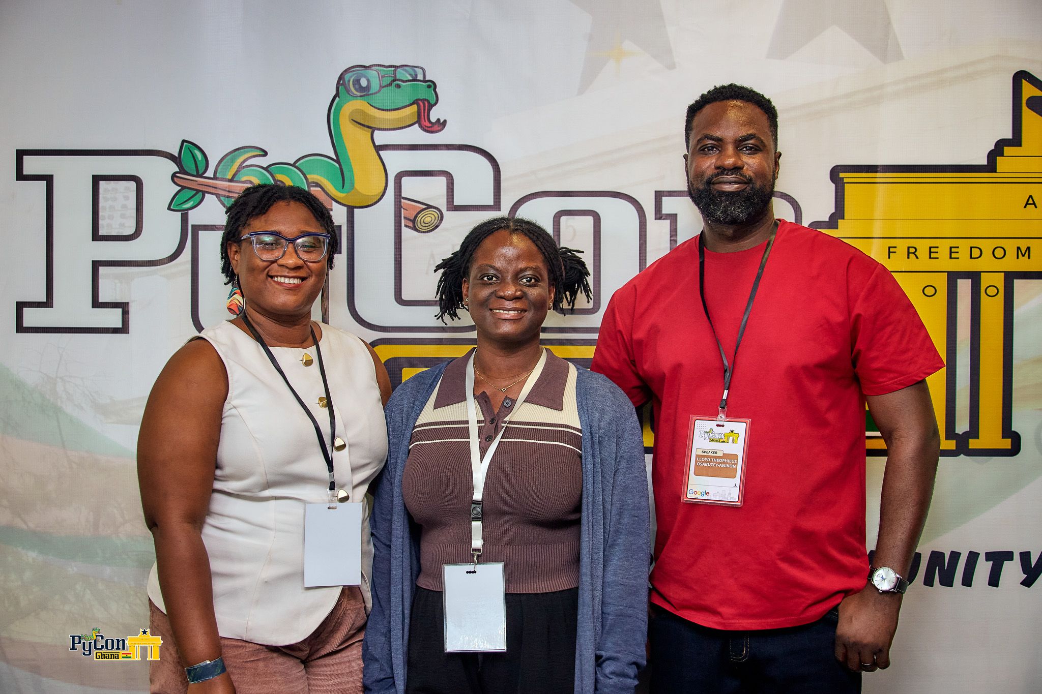 AmaliTech's team at PyCon Ghana 2026, including speaker Lloyd Osabutey, in front of the conference backdrop.