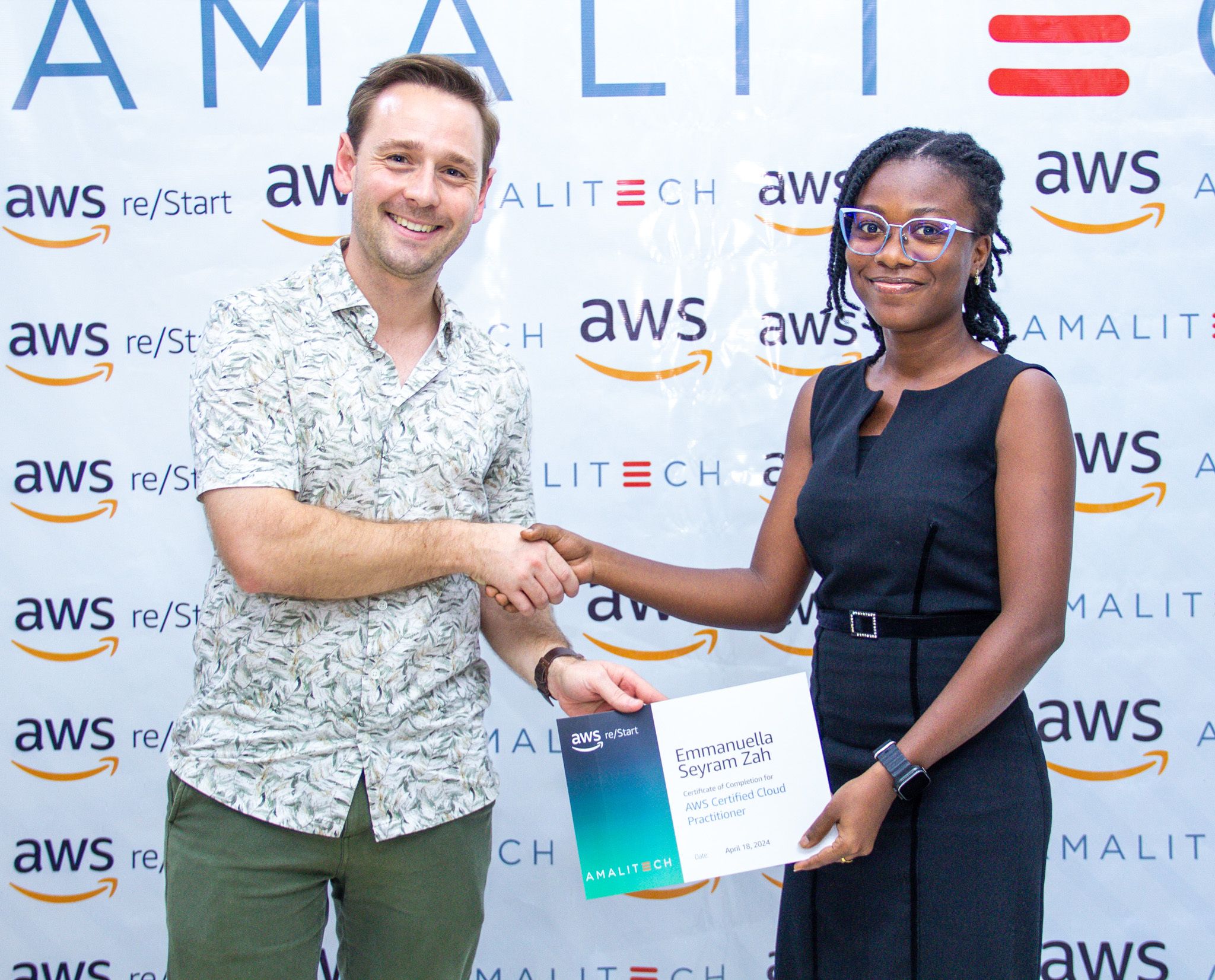 a man presenting a certificate to a young lady