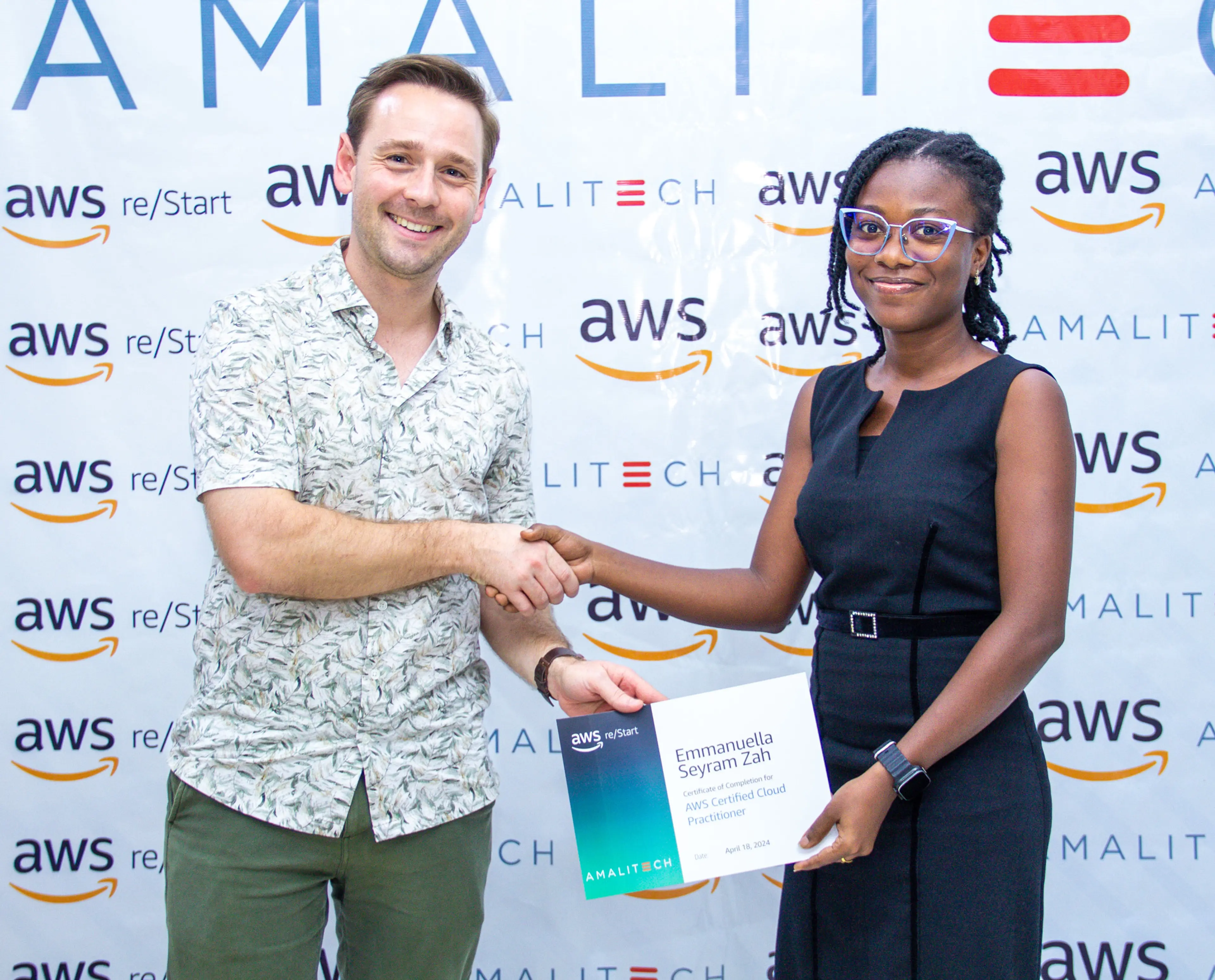 a man presenting a certificate to a young lady