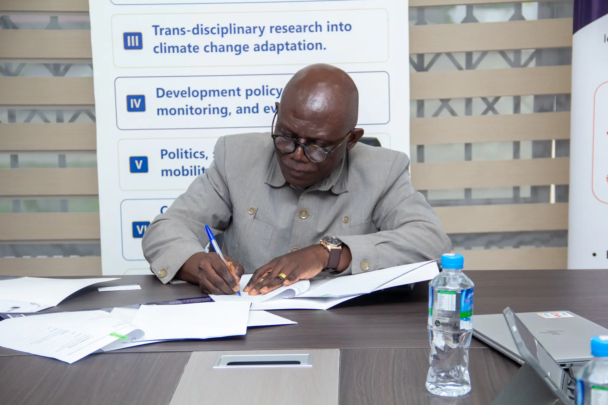 Pro Vice-Chancellor for Research, Innovation and Development at the University of Ghana signing the MoU