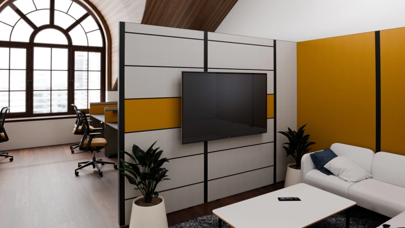 Multiwa-Wand mit Stoffbezug und montiertem Großbildschirm trennt Arbeitsplätze von der Loungezone