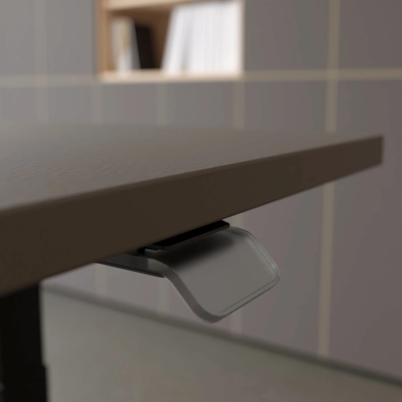 Nahansicht der lavagrauen Plattenkante eines 25-table Q mit transparentem Bedienhebel darunter.