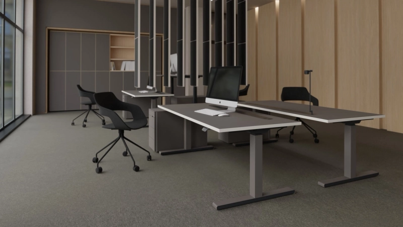 Mehrere 25-table Q mit lavagrauer Platte, heller Kante und grauem Gestell, teils auf unterschiedlicher Höhe.