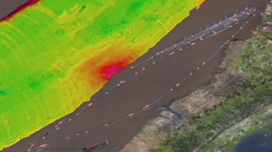 Observed section of the surface showing localised shoaling in the upper layer near the outflow area. Elevated features visible in the high-frequency band detail resemble dredge marks but represent residual high spots of material left behind after dredging