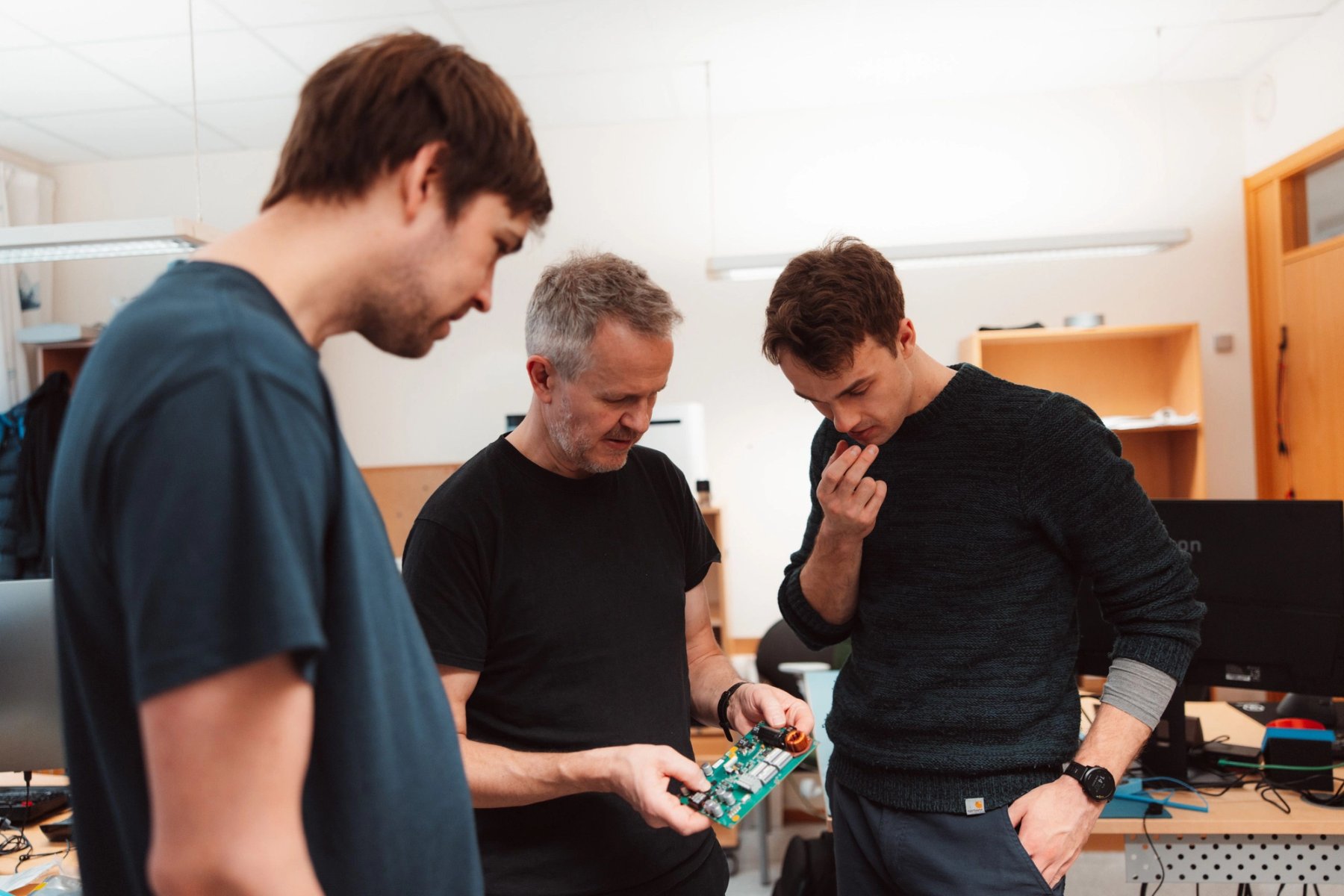 engineers studying circuit board