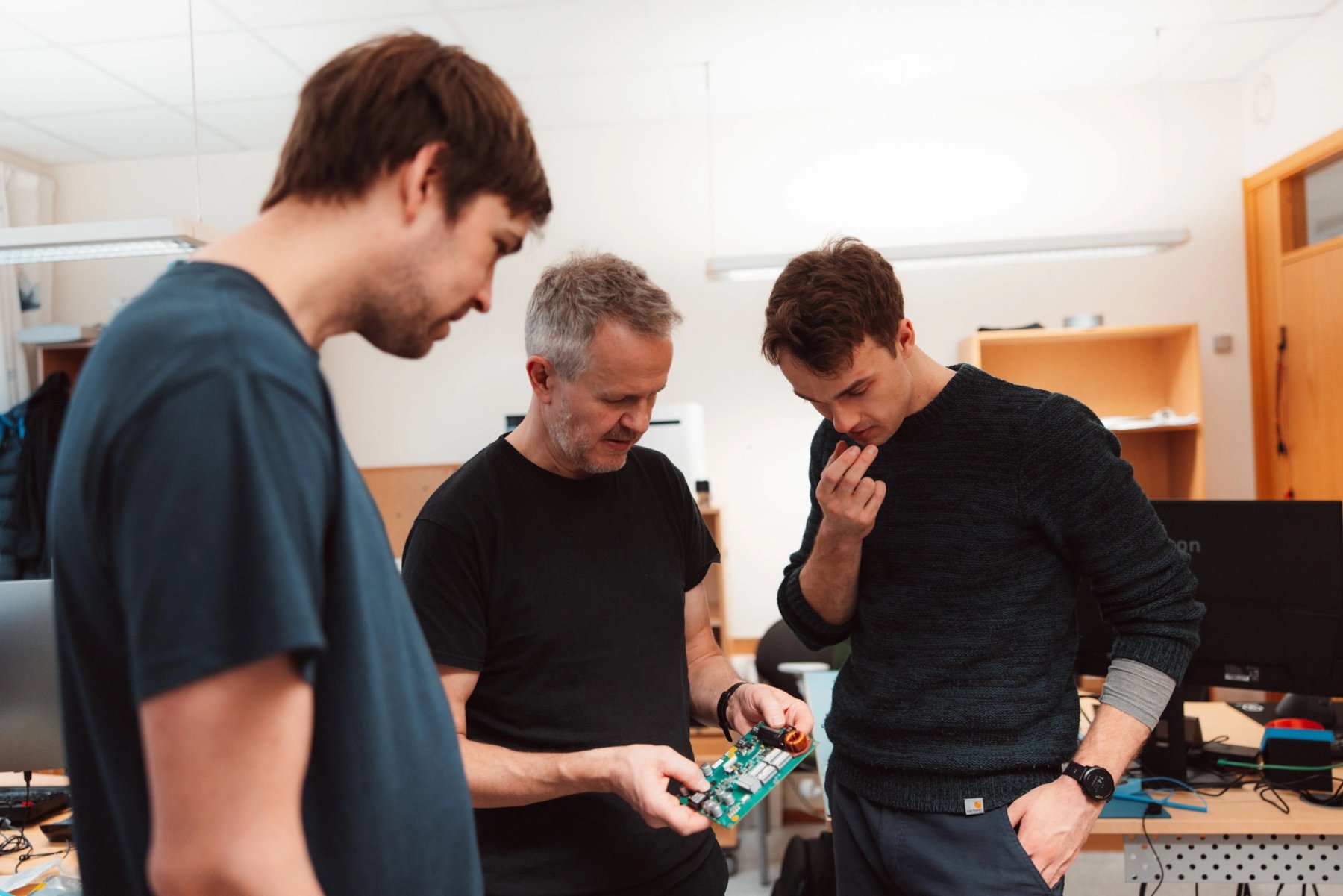engineers studying circuit board
