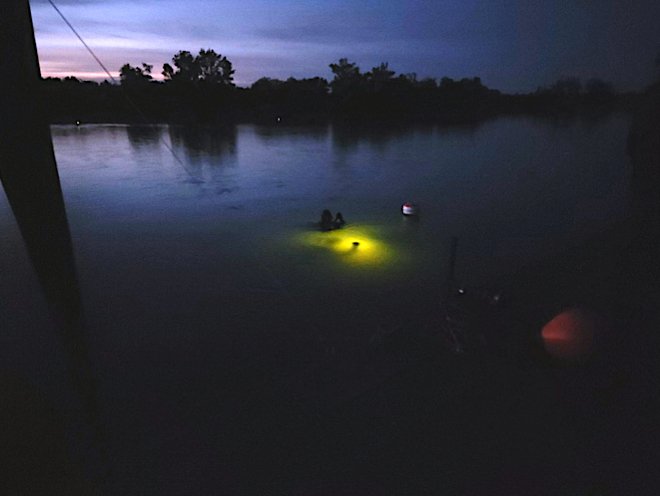 Divers during the testing at night