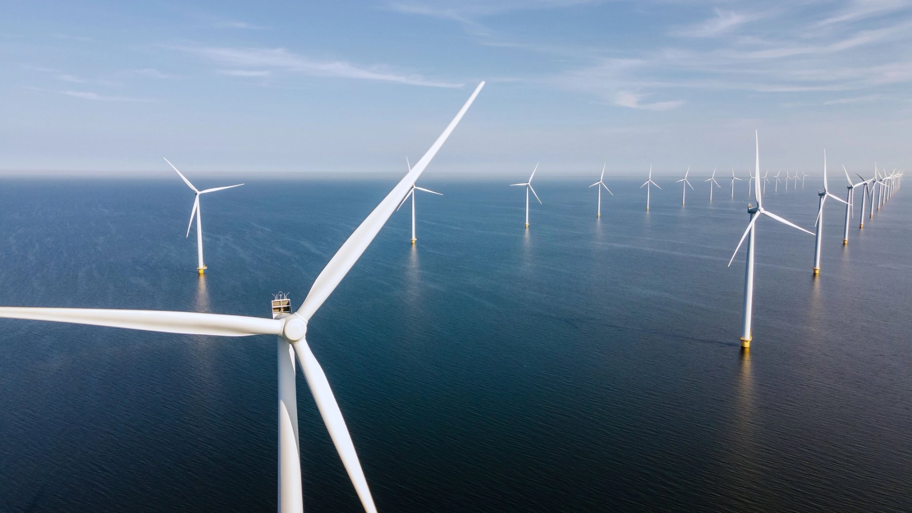 Aerial view of offshore wind turbines in ocean