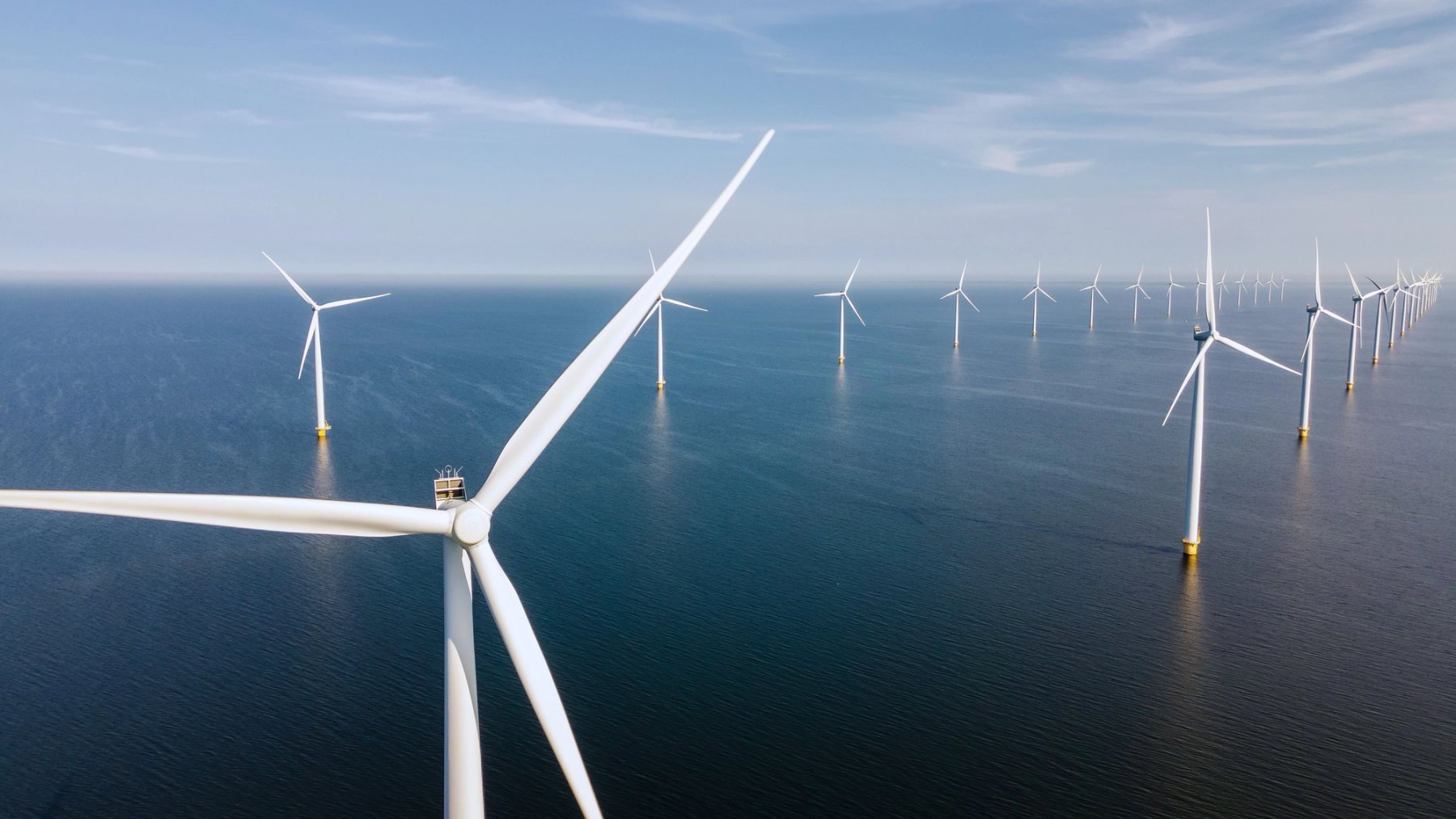 Aerial view of offshore wind turbines in ocean