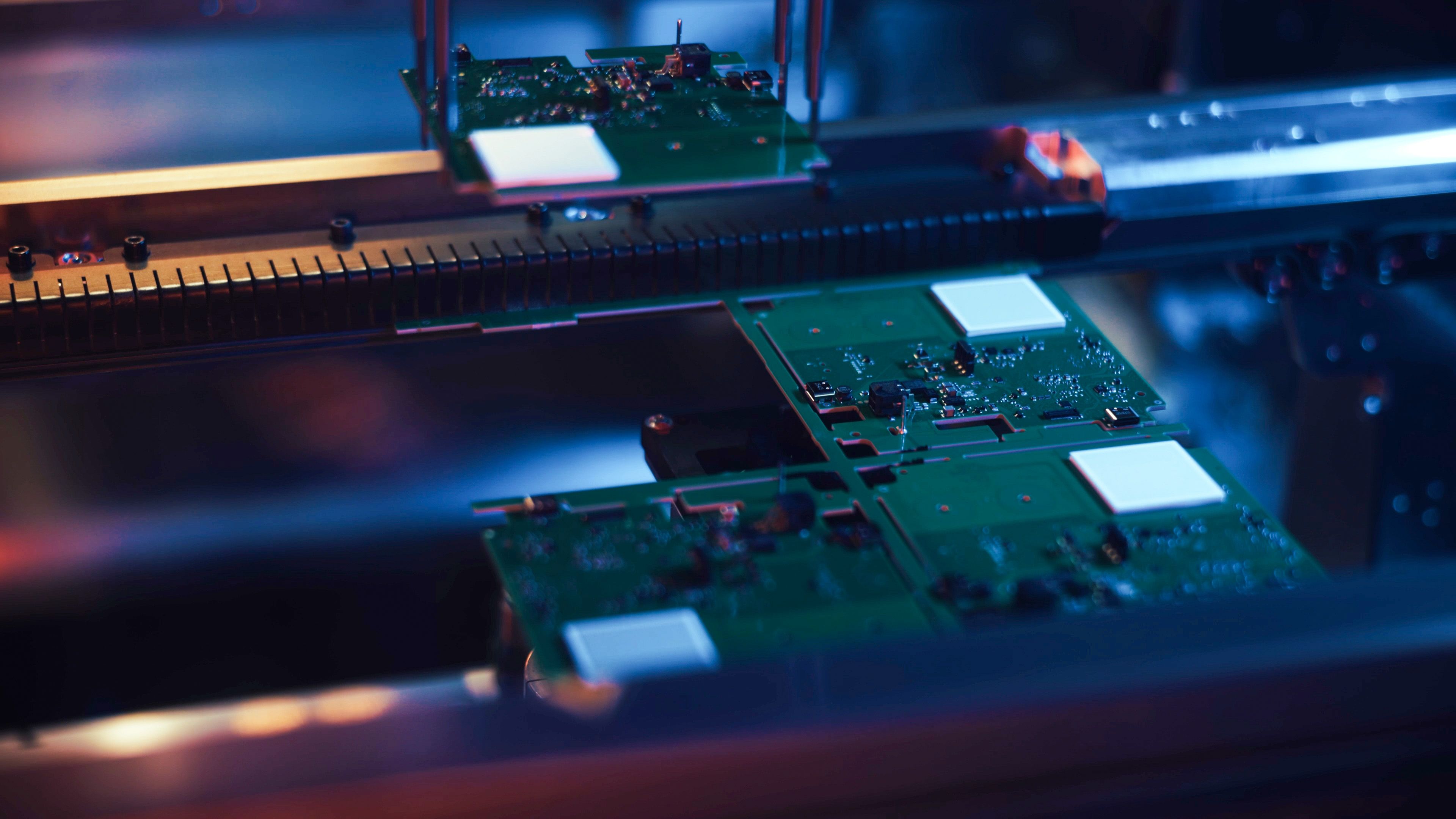 Automated assembly robot working with circuit boards on production line