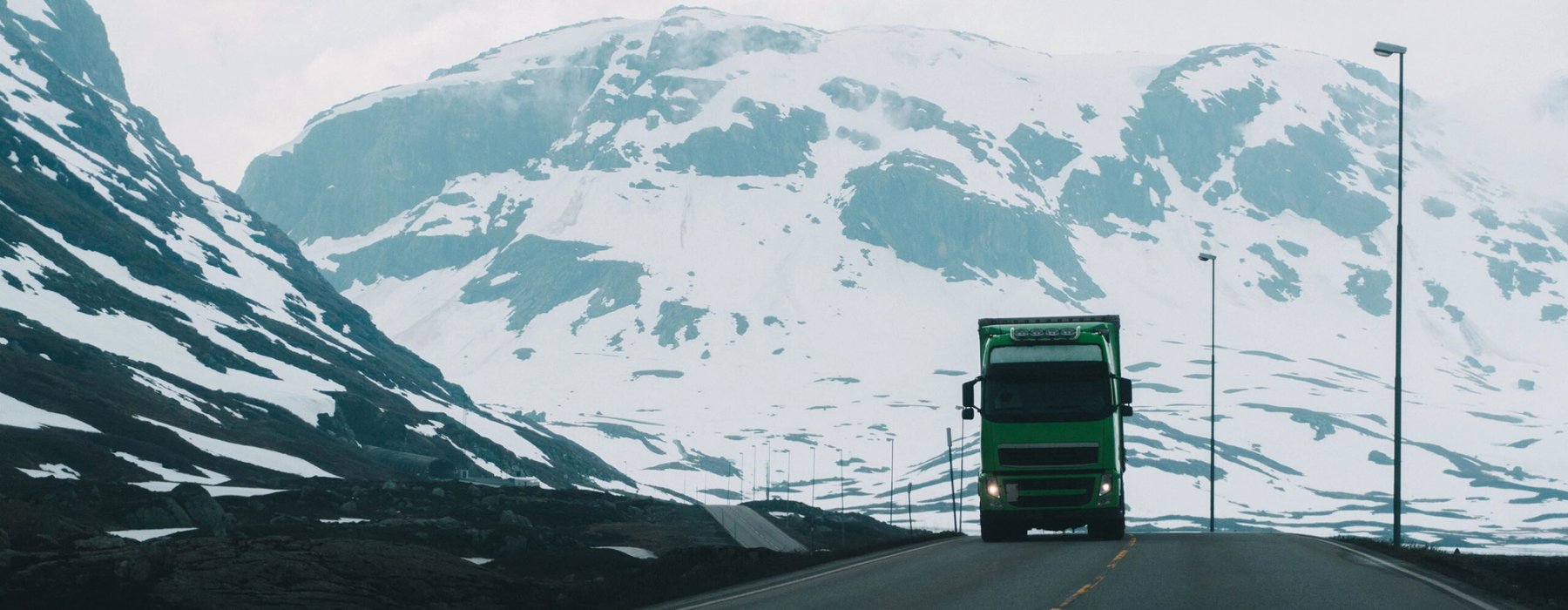 truck driving over mountain pass