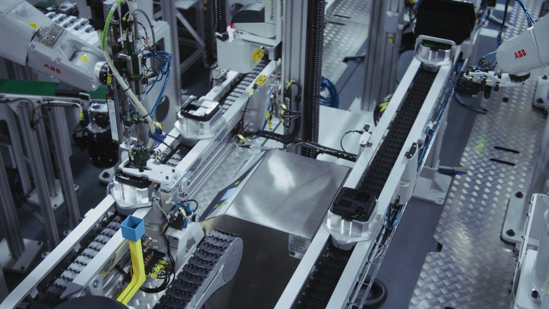 Automated assembly robot working with circuit boards on production line