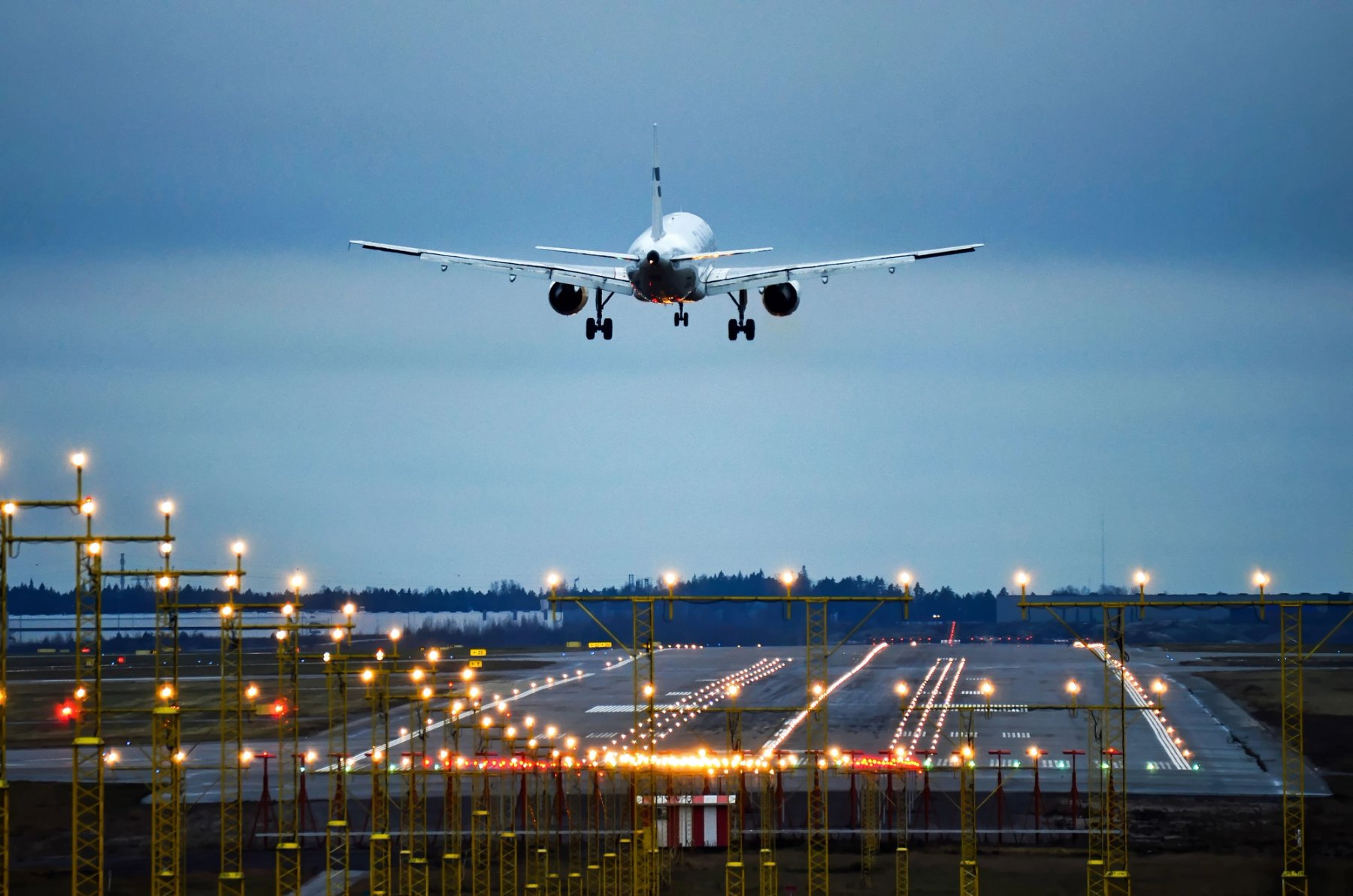 Plane above landing strip