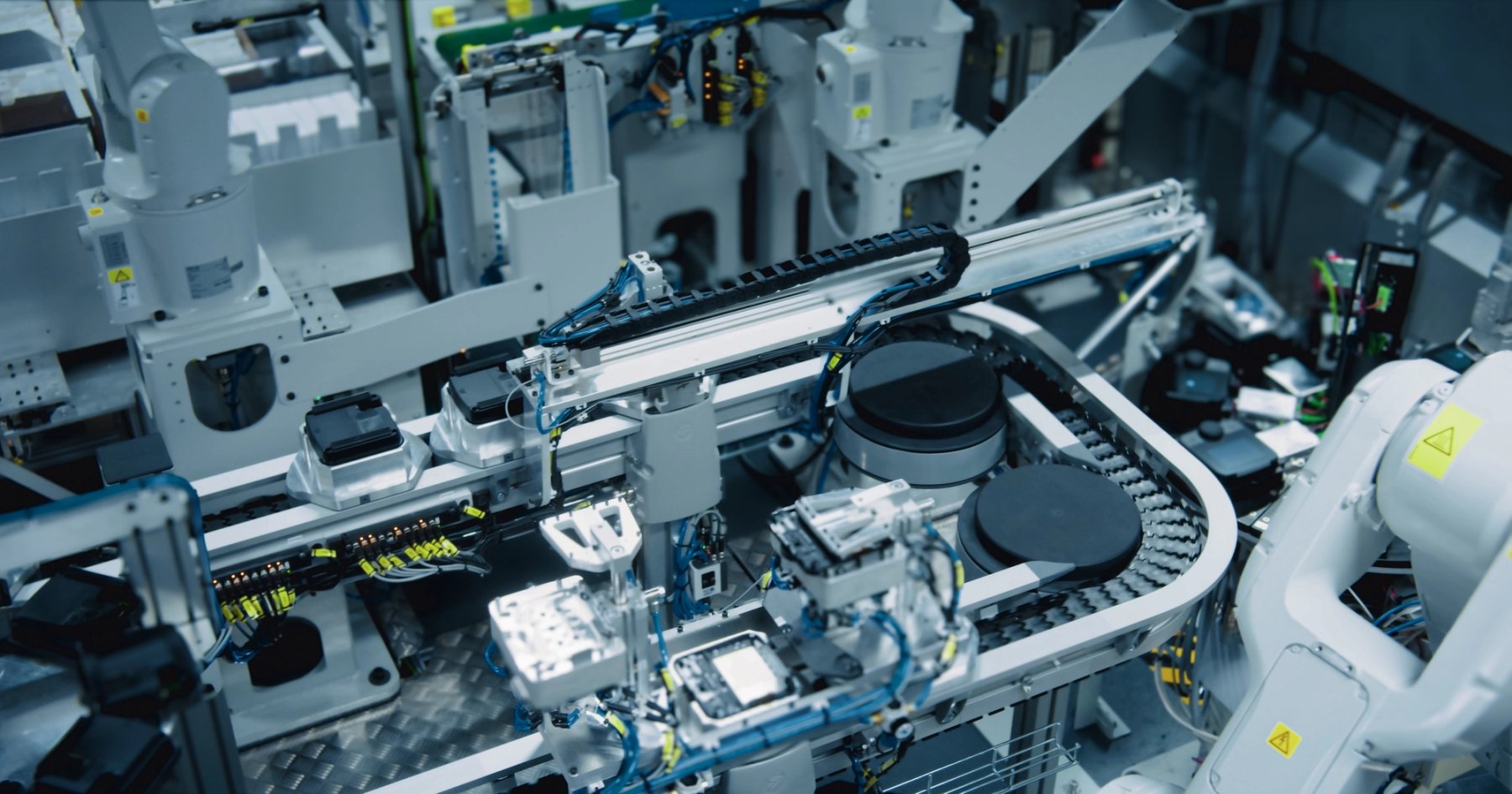 Automated assembly robot working with circuit boards on production line