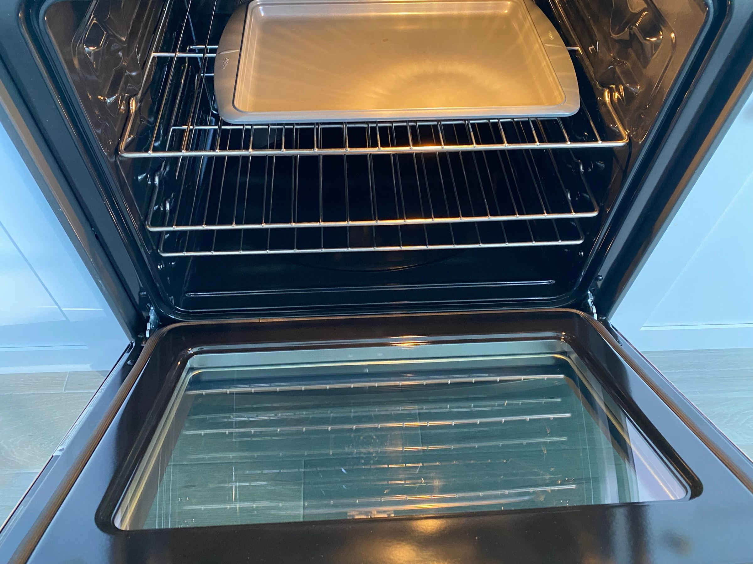 An oven cleaned inside by Classmaids, the racks and door glass spotless