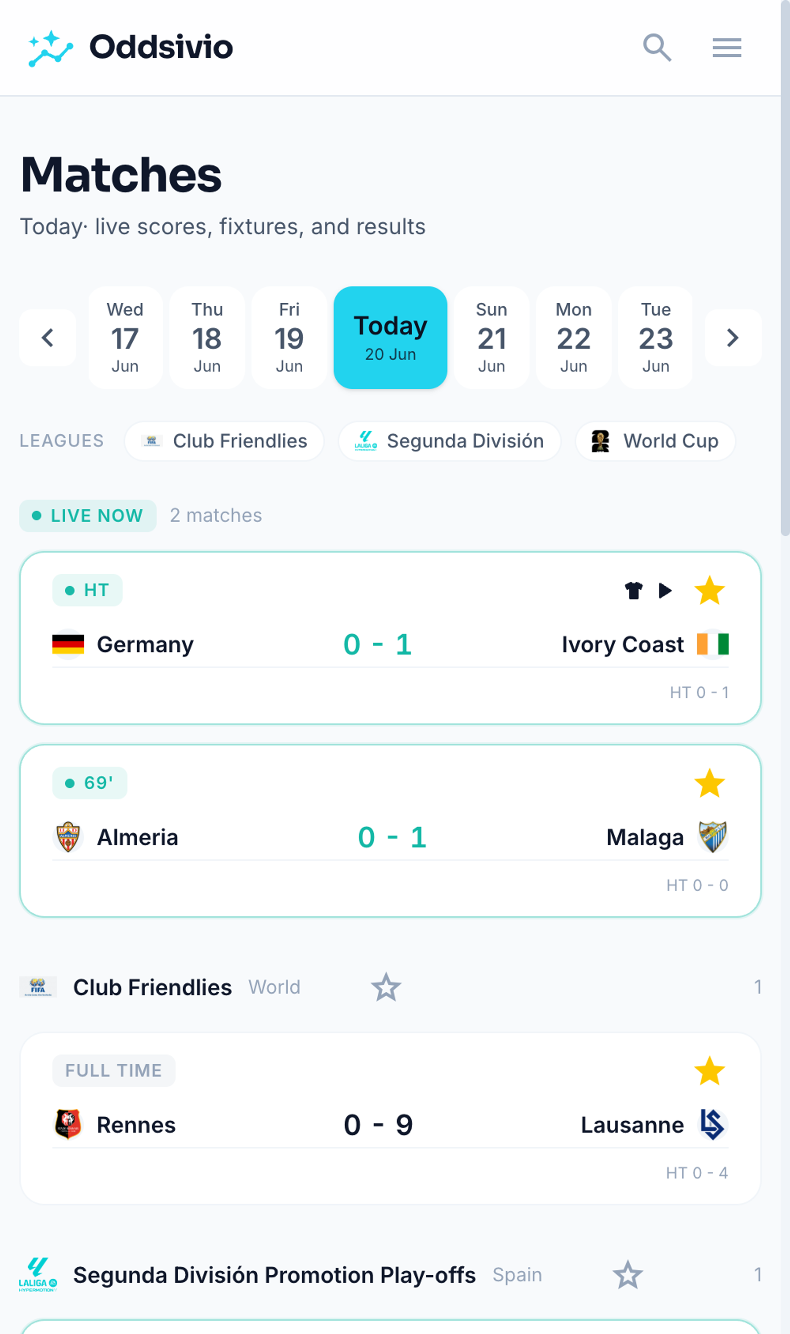 Matches hub on mobile, with fixtures grouped under World Cup, Club Friendlies and Segunda headings.