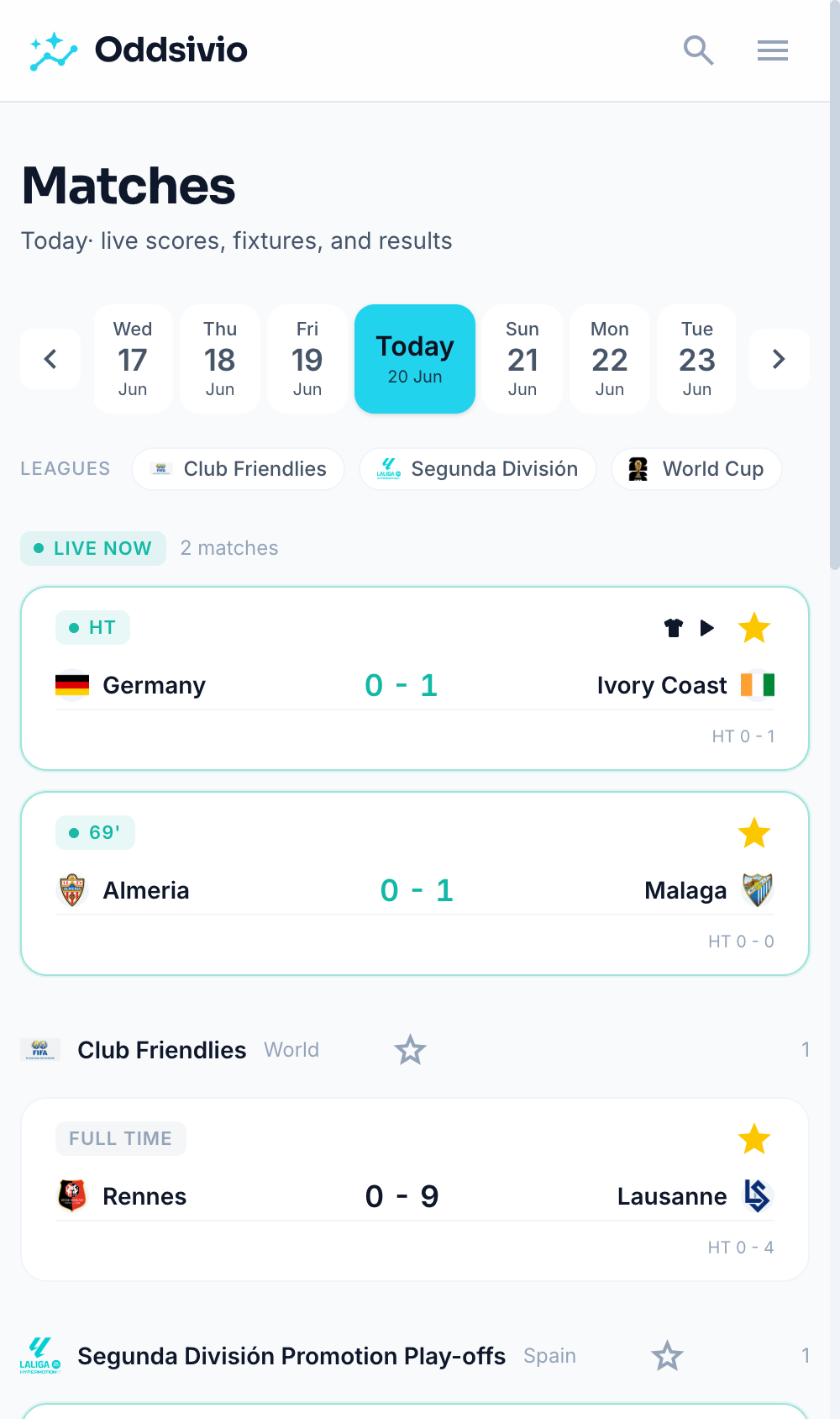 Matches hub on mobile, with fixtures grouped under World Cup, Club Friendlies and Segunda headings.