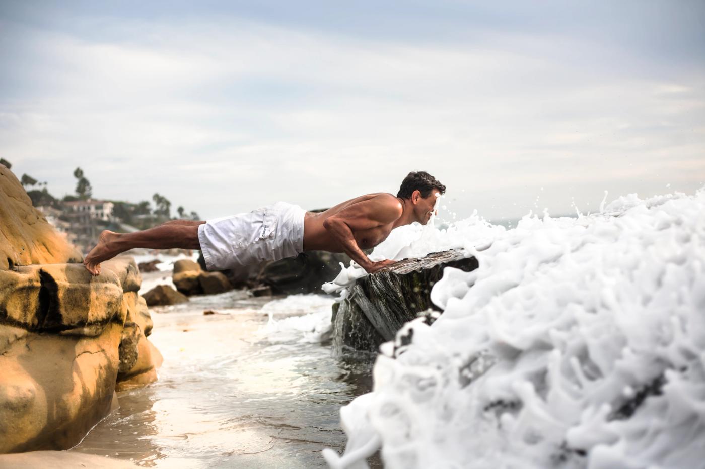 A yoga teacher offering a careful hands-on assist