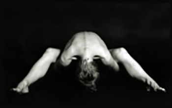 A resting forward fold, forehead down.