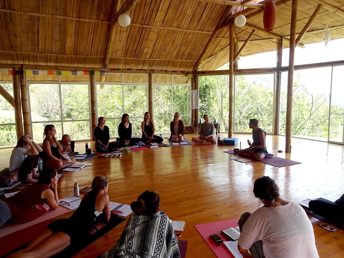 Students seated in a circle in the shala.