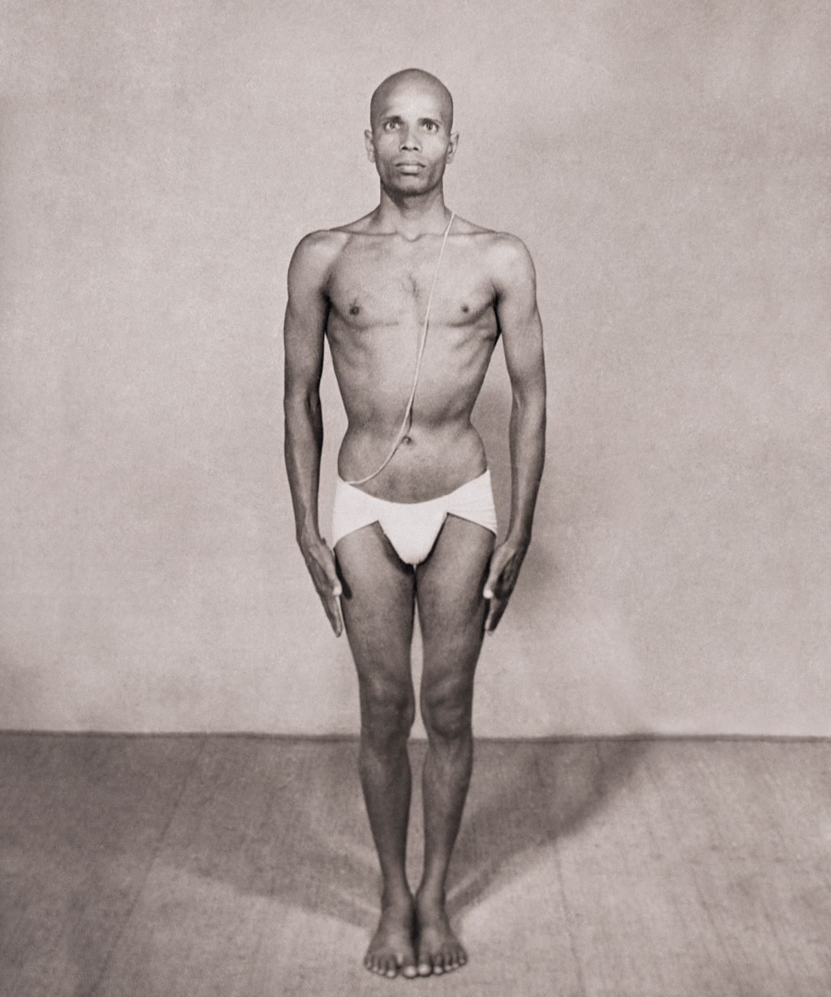 Sri K. Pattabhi Jois standing in Samasthiti.