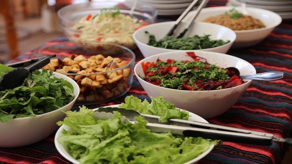 Bowls of nuts, herbs, and salsa.